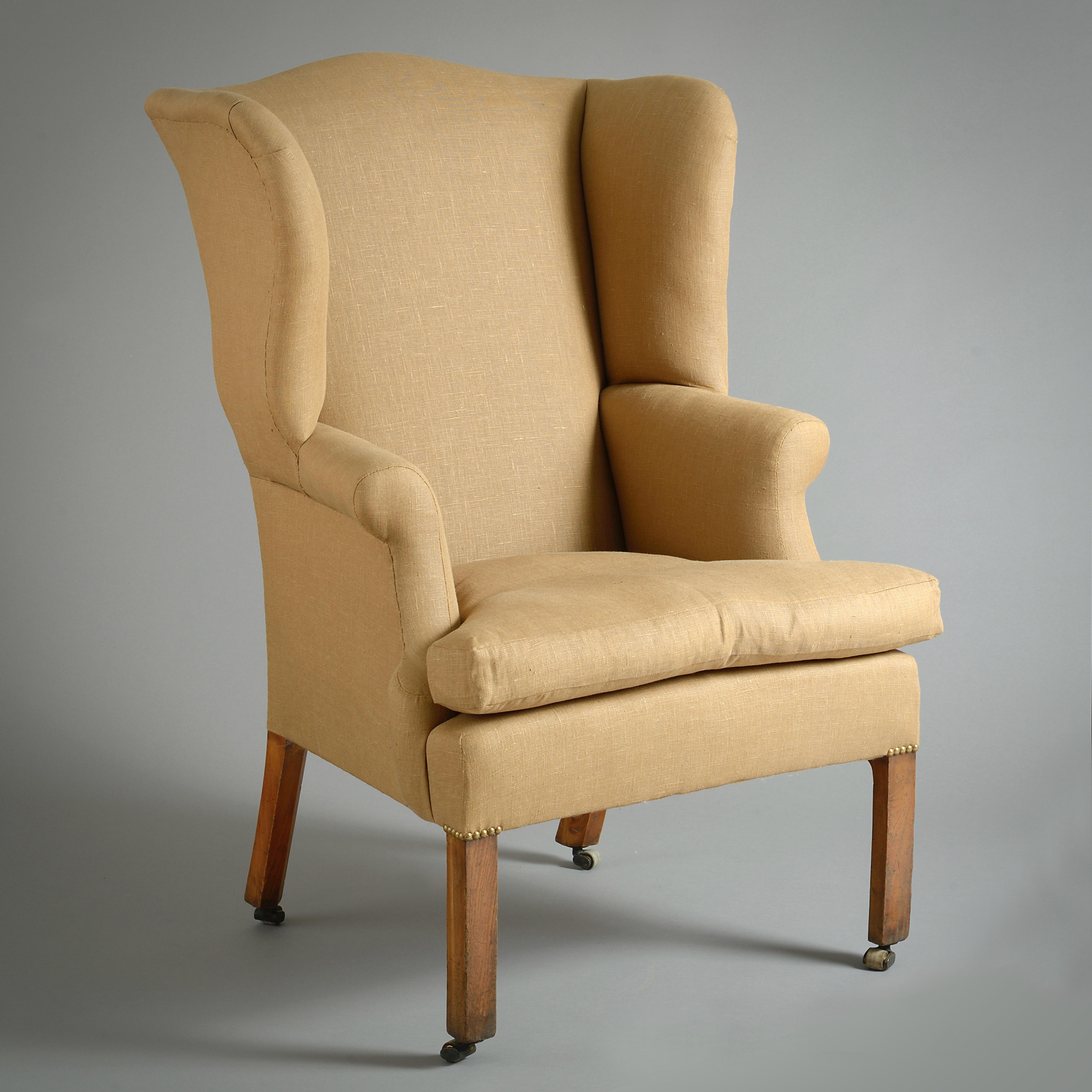 RARE PAIRE DE FAUTEUILS ÉCOSSAIS EN FRÊNE À DOSSIER EN AILE DE GEORGE II, VERS 1760.

Pieds carrés chanfreinés sur roulettes en laiton et cuir.

Provenance :
Fourni à Sir James Clark, 3e baronnet de Penicuik, pour Penicuik House, Midlothian ;
puis