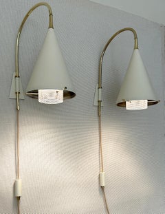 Raro par de lámparas de pared de brazo articulado de Gerald Thurston