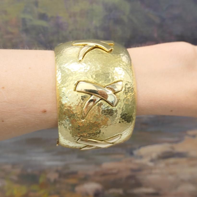 This bold vintage cuff bracelet from Paloma Picasso’s Graffiti collection reflects the designer’s signature blend of strength and movement. Made from hammered 18k gold, the wide band features a textured surface that adds a lot of character. The most