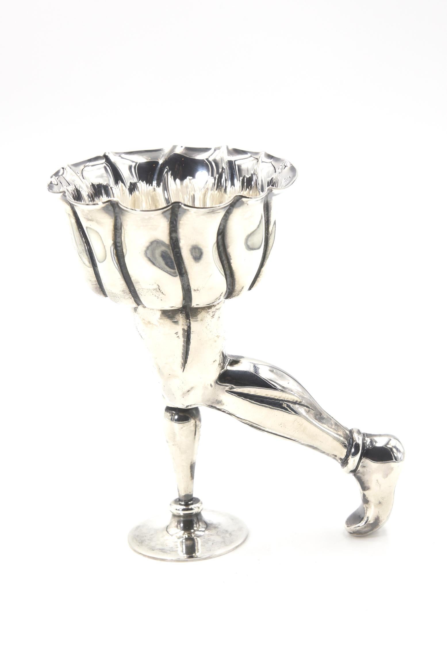 Interesting sterling silver figural footed wine cup made by Pampaloni silver from the Bichierografia collection which was inspired by the 17th century works of painter Giovanni Maggi. The scalloped cup are stands on legs one terminates in a foot the