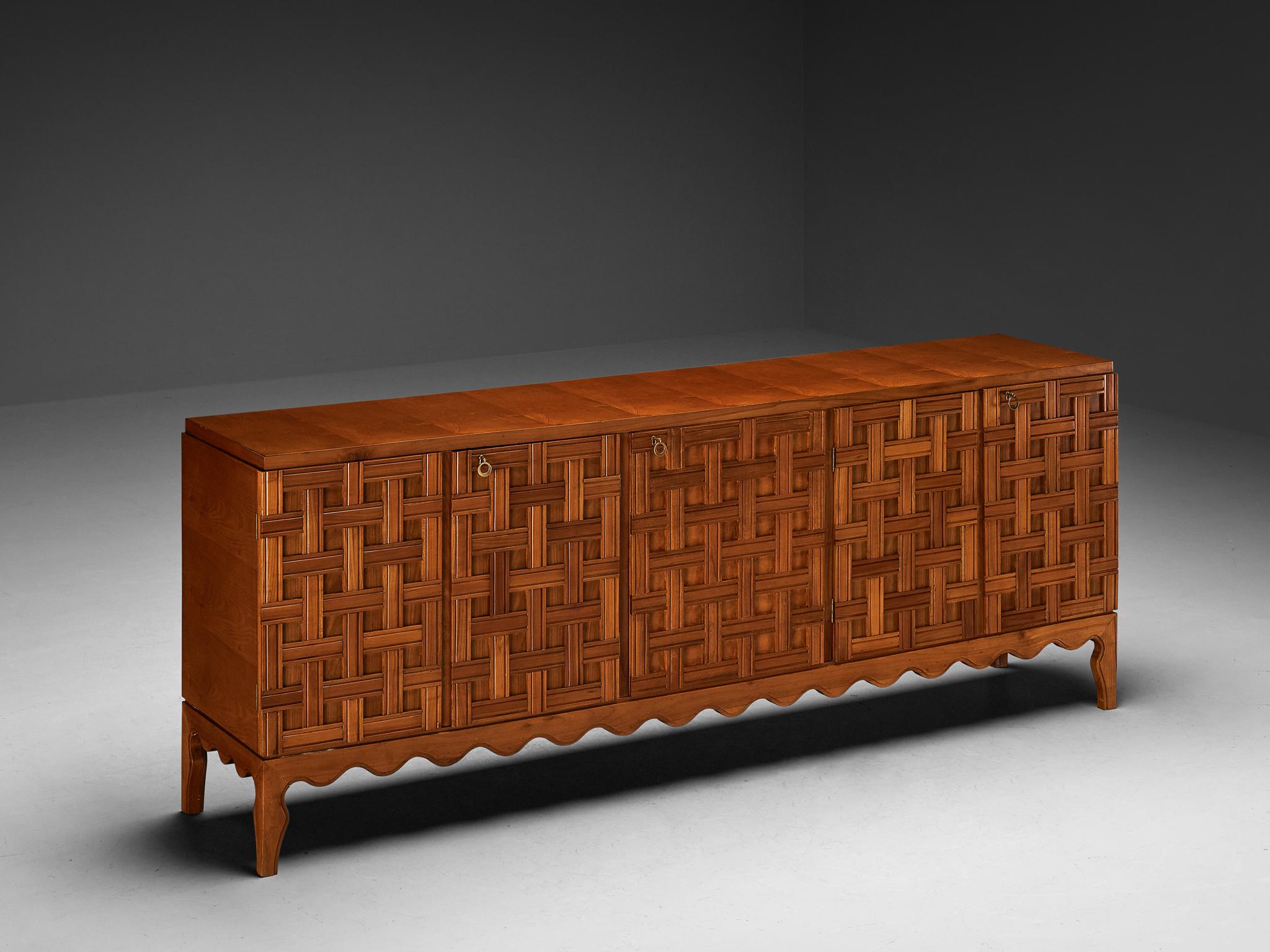 Paolo Buffa, sideboard, cherry, mahogany, brass, mirrored glass, glass, Italy, 1940s

Crafted by the visionary Italian designer and architect Paolo Buffa (1903-1970), this rare credenza exudes a refined decorative allure. It serves as a