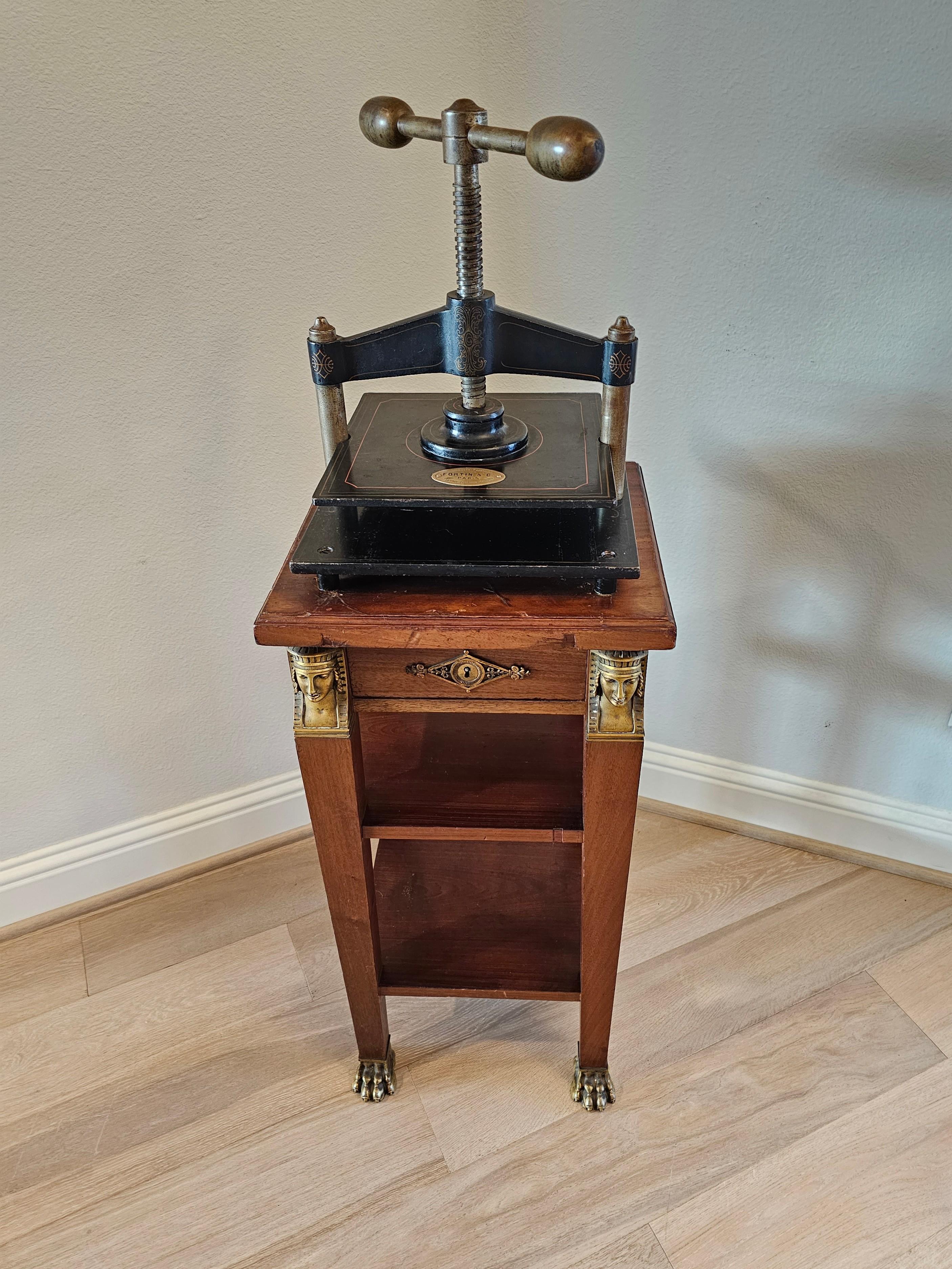 A rare, one-of-a-kind antique, circa 1890, Parisian cast iron bookpress stand by important French publisher Fortin et Cie, 57 Rue des Petits-Champs, Paris, France.

Late 19th century, having a heavy industrial cast iron hand-crank screw press book