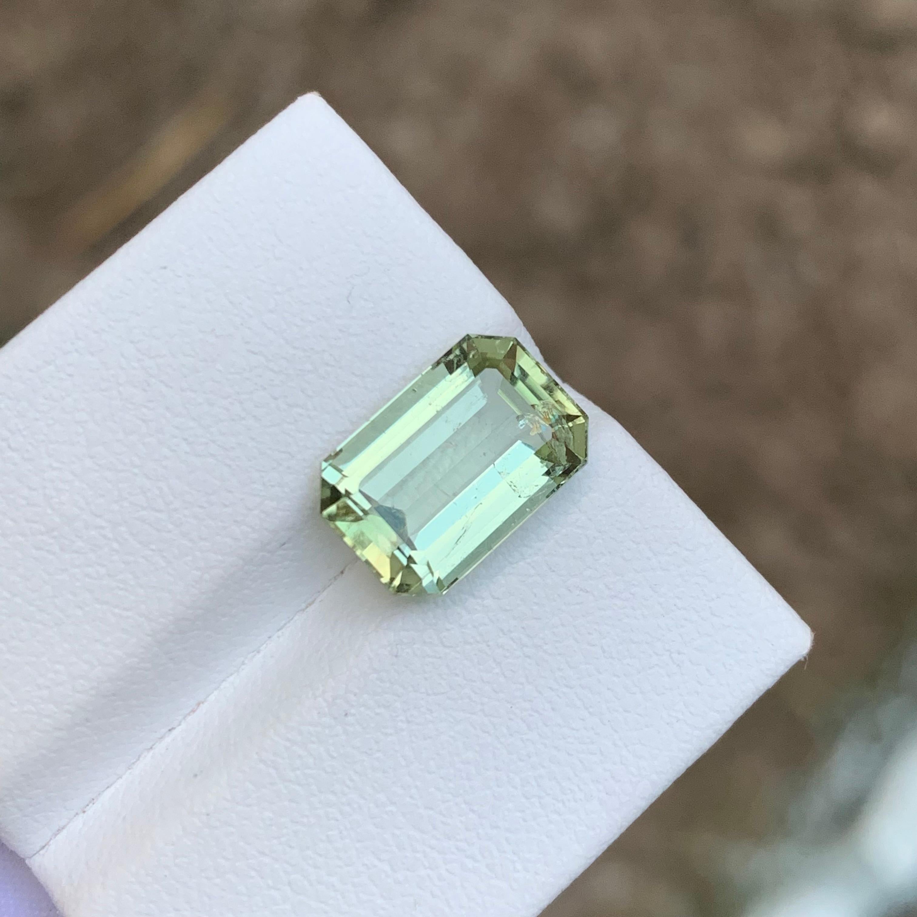 GEMSTONE TYPE: Tourmaline
PIECE(S): 1
WEIGHT: 5.05 Carats
SHAPE: Emerald
SIZE (MM): 12.33 x 8.31 x 5.68
COLOR: Pastel Green
CLARITY: Slightly Included 
TREATMENT: None
ORIGIN: Afghanistan
CERTIFICATE: On demand

Indulge in the unparalleled allure of