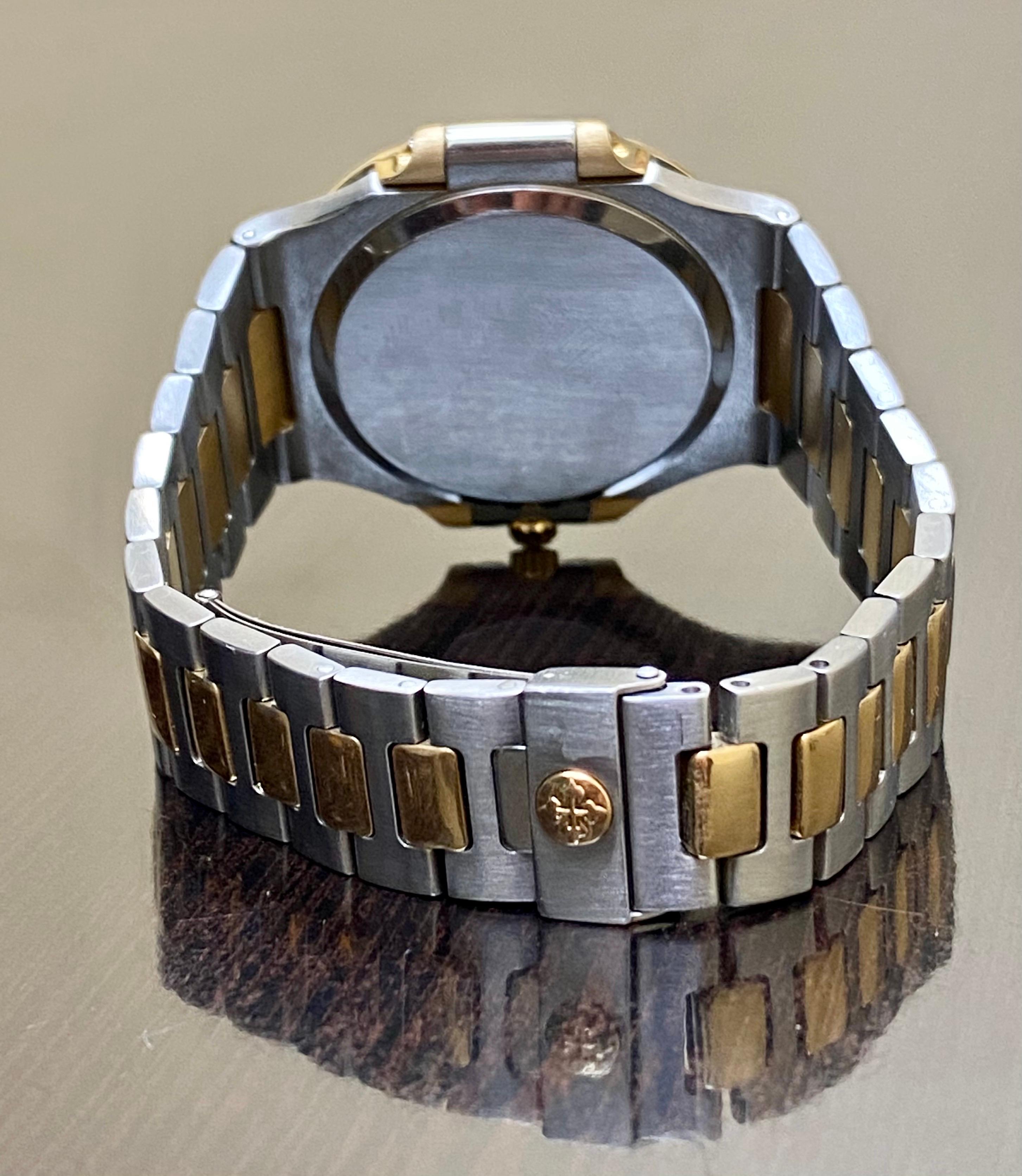 Exceptionally Rare Vintage Patek Philippe Two-Tone Stainless Steel and 18K Yellow Gold Champagne Dial 3700/11 Nautilus offered here for sale.  It is preserved in very good overall condition, with original papers.  Watch has been recently overhauled