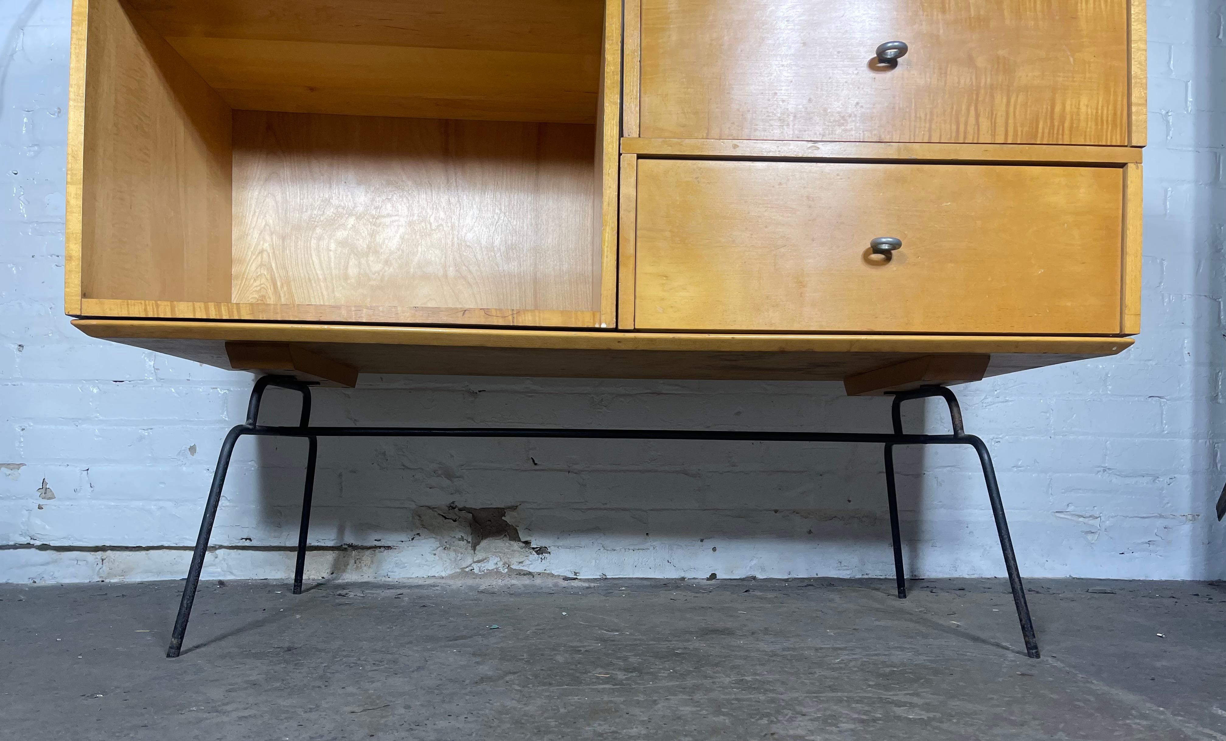 Unusual Paul McCobb modular cabinet on rare iron base, aluminum ring pulls..solid maple construction . 40 years in the business , I have owned several Paul McCobb pieces ,I have never seen or owned this rare example on this original iron base.Great