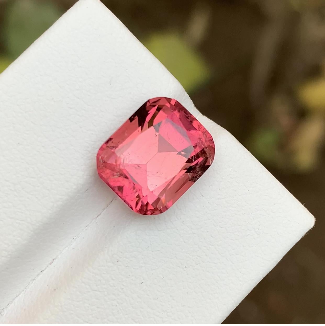 GEMSTONE TYPE: Tourmaline
PIECE(S): 1
WEIGHT: 7.25 Carats
SHAPE: Cushion
SIZE (MM):  11.77 x 9.81 x 8.27
COLOR: Peachy Pink
CLARITY: Slightly Included 
TREATMENT: Heated
ORIGIN: Afghanistan 🇦🇫 
CERTIFICATE: On demand

This stunning peachy pink
