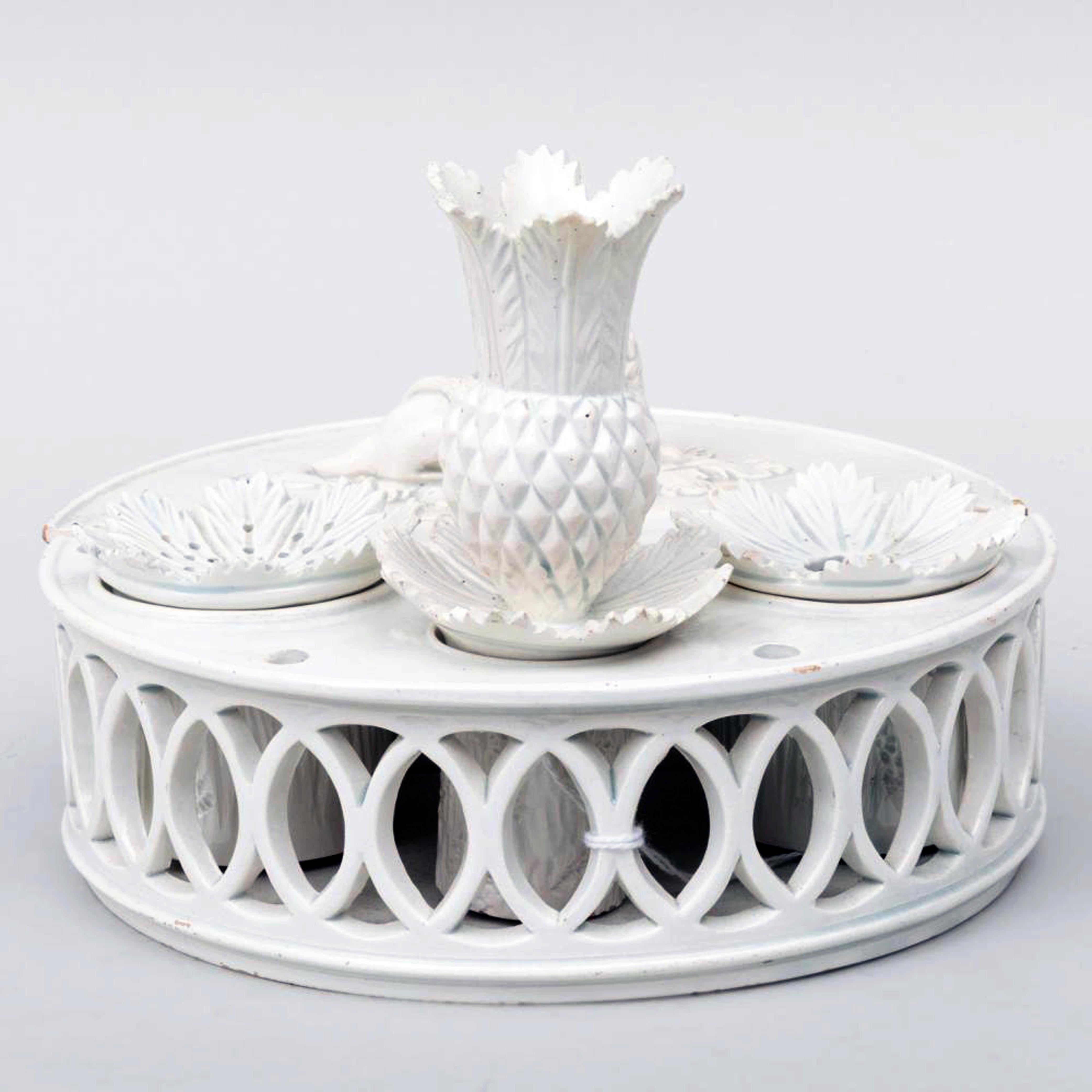 Rare Pearlware Ink Stand with pineapple-shaped candleholder,
Sewells, St. Anthonys Pottery, Newcastle,
Circa 1804-20.

A wonderful pearlware inkstand complete with all its parts. The Stand consists of a lower circular section with an impressed