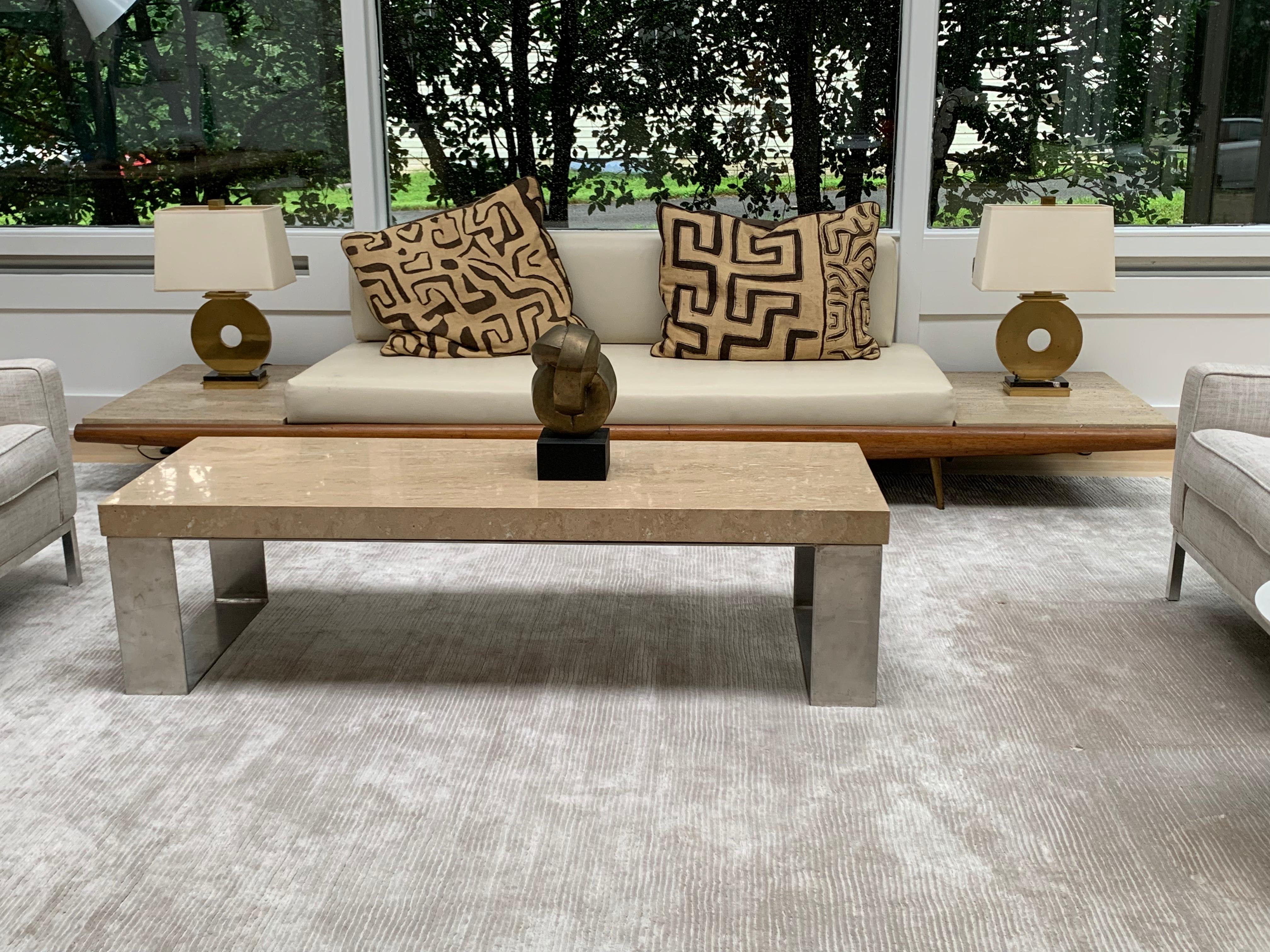  Adrian Pearsall sofa designed with built-in Italian travertine side tables. New foam and faux leather. Original finish on walnut frame and brass feet.