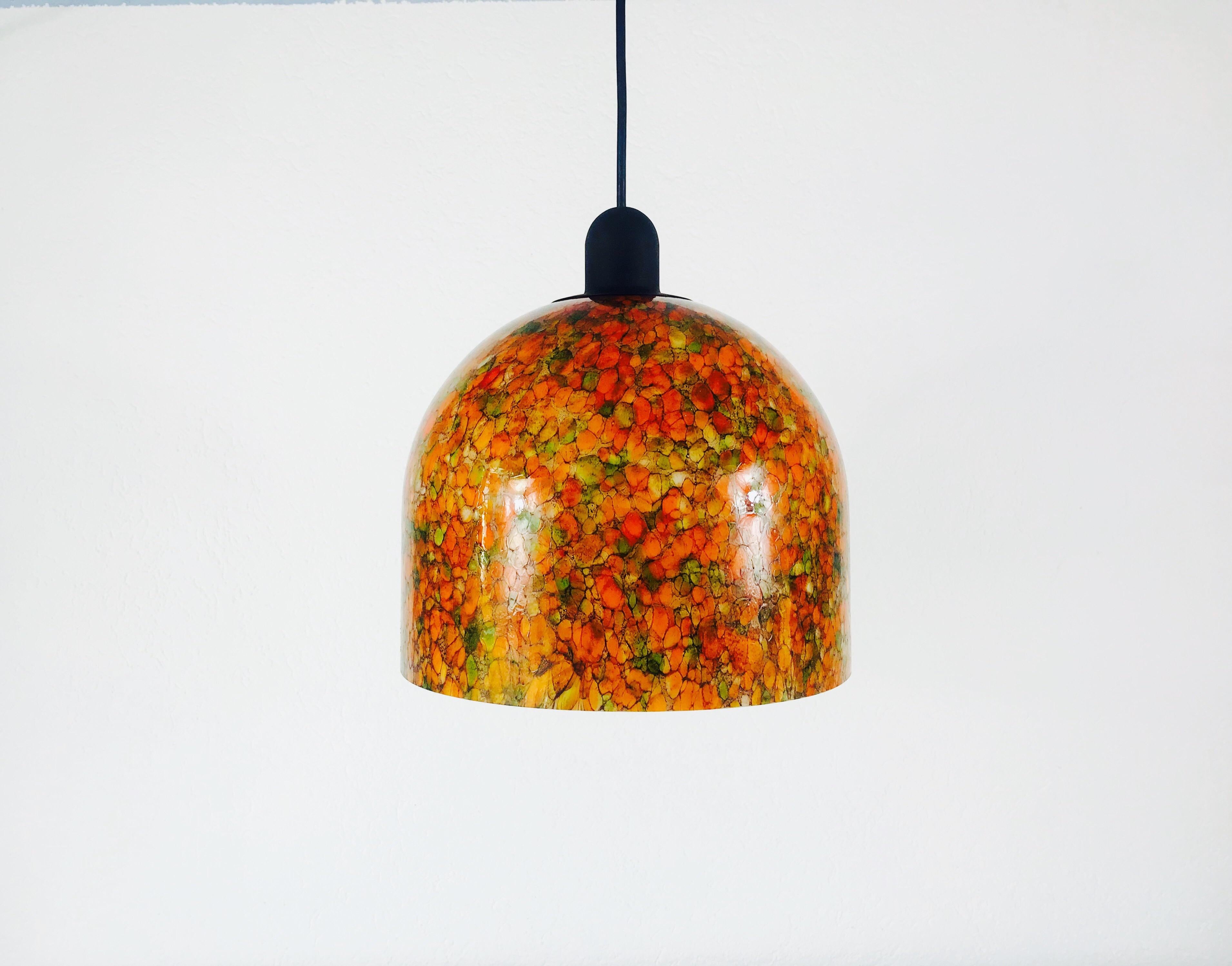 A Peill and Putzler pendant lamp made in Germany in the 1970s. It is fascinating with its rare glass shape. The lamp was created in design of Tiffany and has orange and green colors.

Measurements:

Height: 90 cm

Diameter: 30 cm

The light