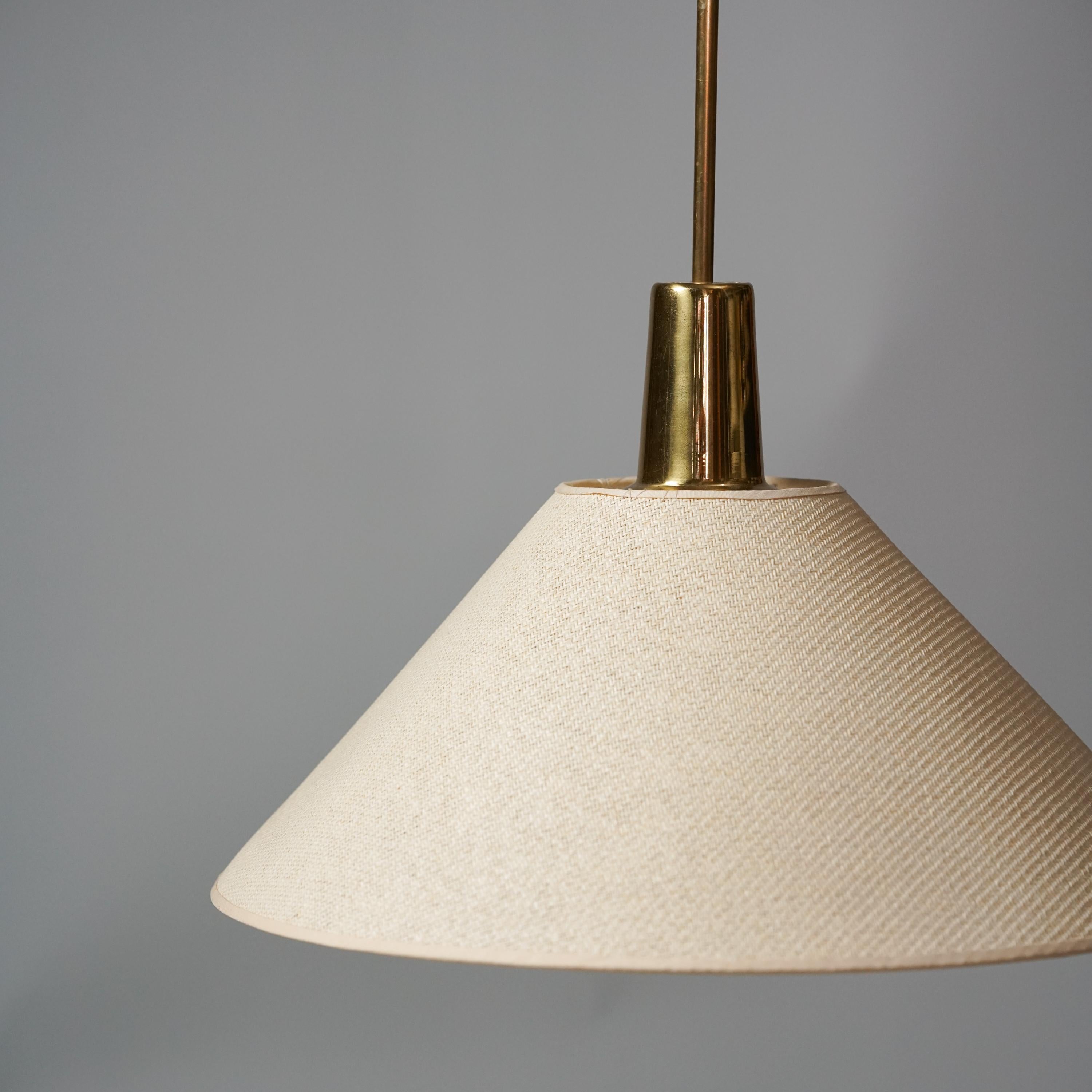Rare Pendant by Lisa Johansson-Pape for Orno, 1950s. Brass, painted metal and fabric shade.  Good condition. 

This piece gives you beautiful light and a classic design of Lisa Johansson-Pape. 