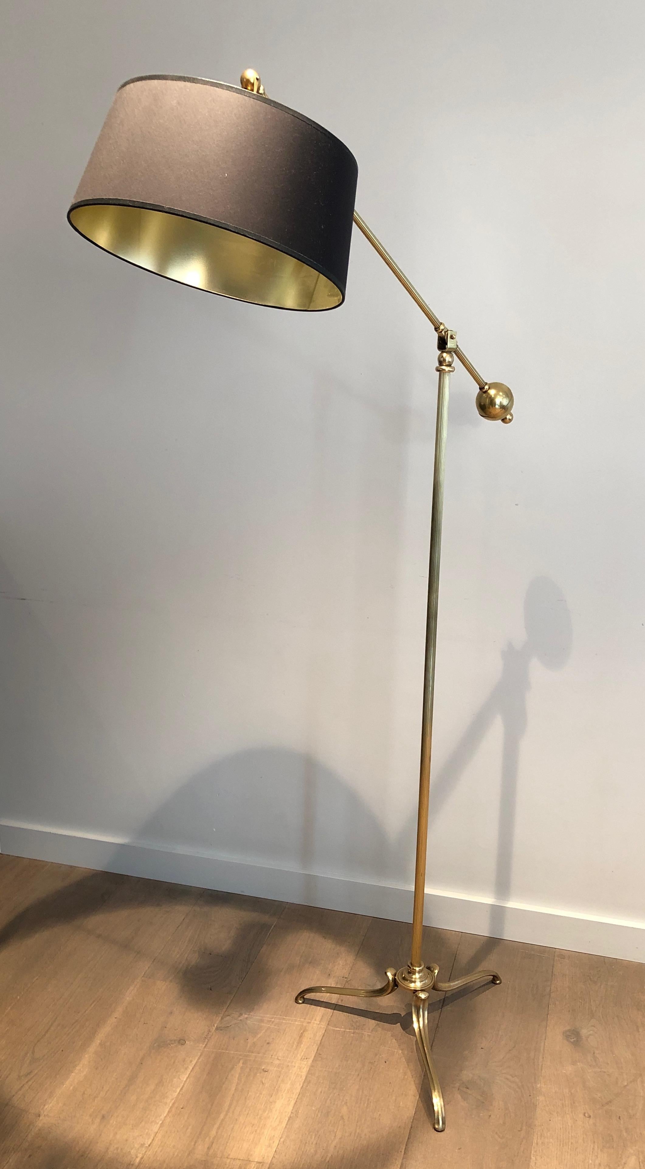 This rare pendulum floor lamp is all made of brass. This is a very unusual model by a French designer, circa 1940.