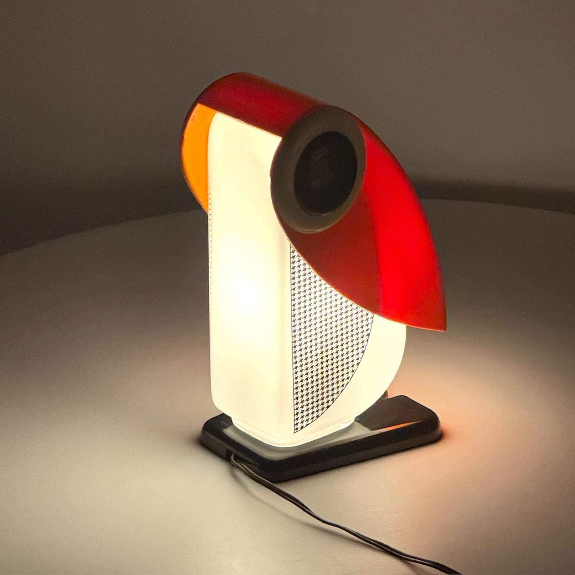 Infuse your home with sophistication and charm with the Penguin Table Lamp, an exquisite creation by Fernando Cassetta. Designed in the 1970s for Tacman Manara, this piece is part of a highly regarded collection of animal-themed lamps, embodying the