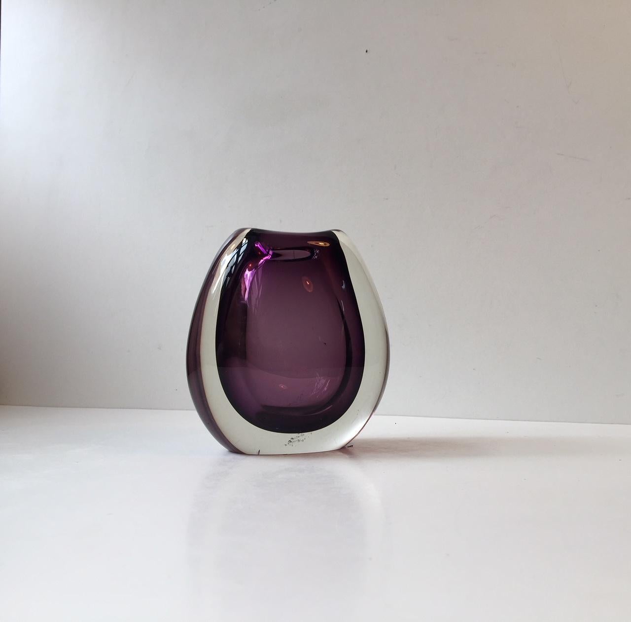 Sommerso art glass vase with a Ametyst purple hue. Designed by Per Lütken and manufactured by Holmegaard in Denmark. This is a rare vase and it was only made in 1955. It is signed by the artist to the base.