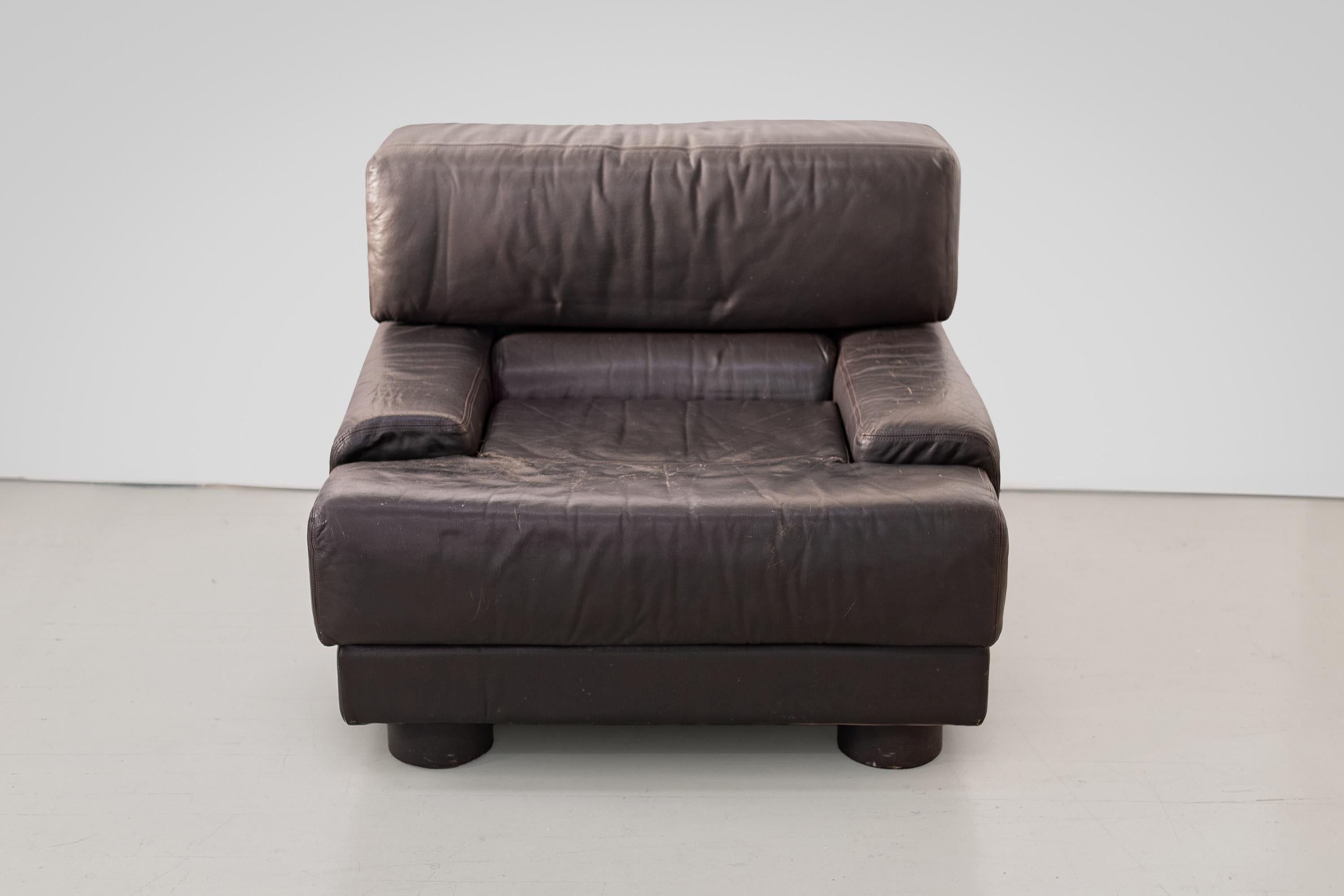 Gorgeous, rare Percival Lafer armchair made by Lafer S.A. in Sao Paolo, Brazil in dark chocolate brown leather. The front feet are rounded leather and the back legs are wheels, which are original. This is an extremely comfortable and supportive