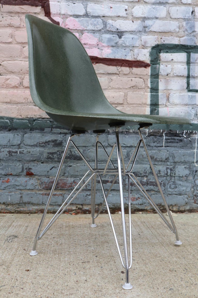 This rare Eames chair is not a shade we have seen often. Comes with chrome Eiffel base. Chair stamped Herman Miller and base retain all 4 glides. Shock mounts adhered tightly to underside of chair. No stress cracks.