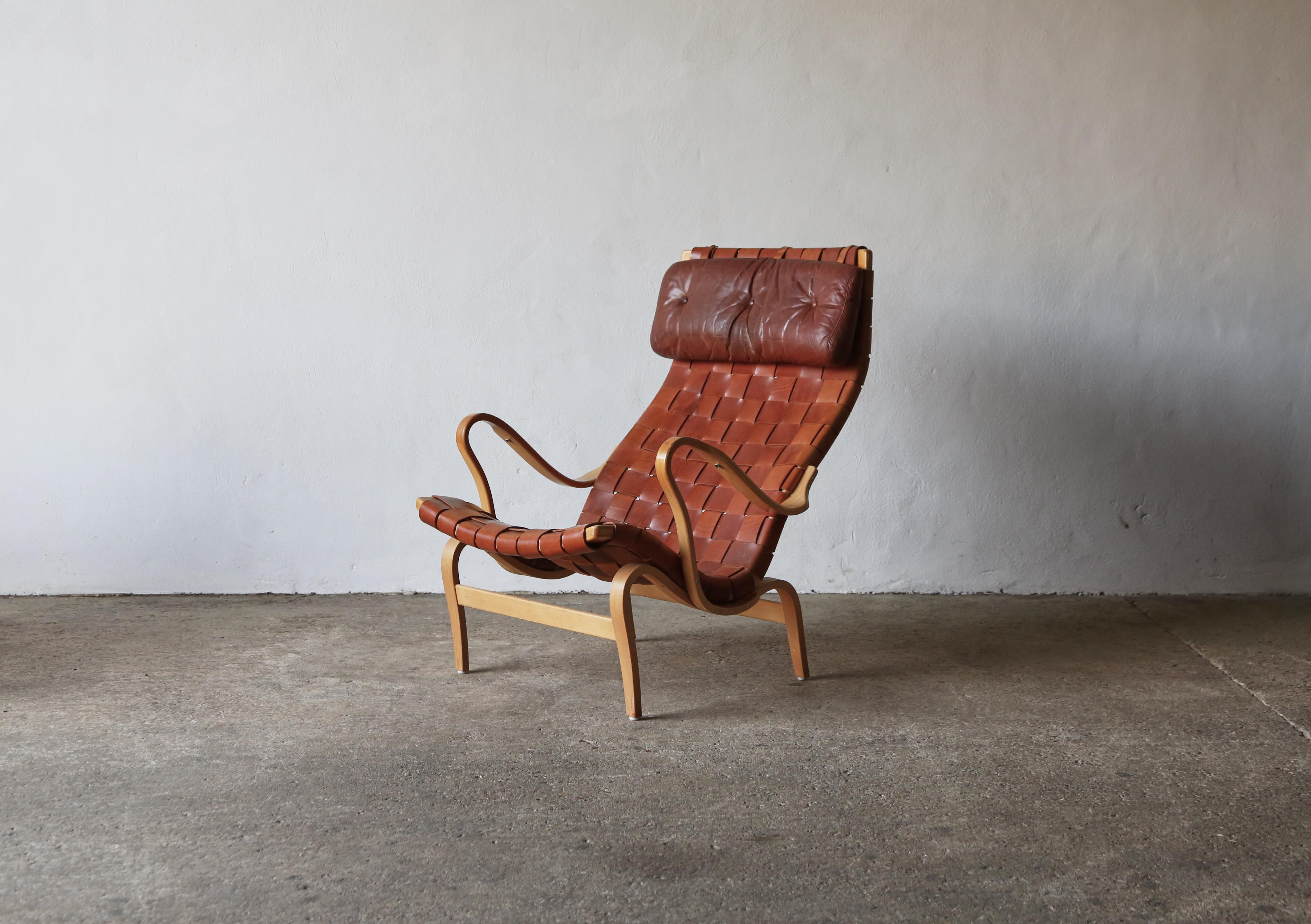 Rare Pernilla chair by Bruno Mathsson, for Dux, Sweden, 1960s. Beech and leather. Signed with branded manufacturer's mark. Fast shipping worldwide.



