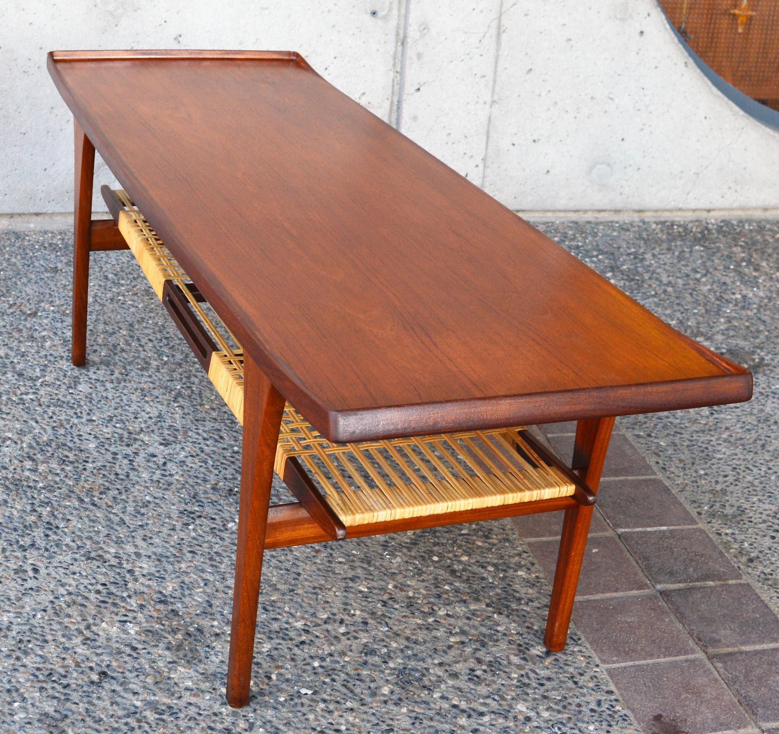 Mid-Century Modern Rare Peter Lovig Nielsen Teak Coffee Table, Flared Ends and Cane Wrapped Shelf For Sale