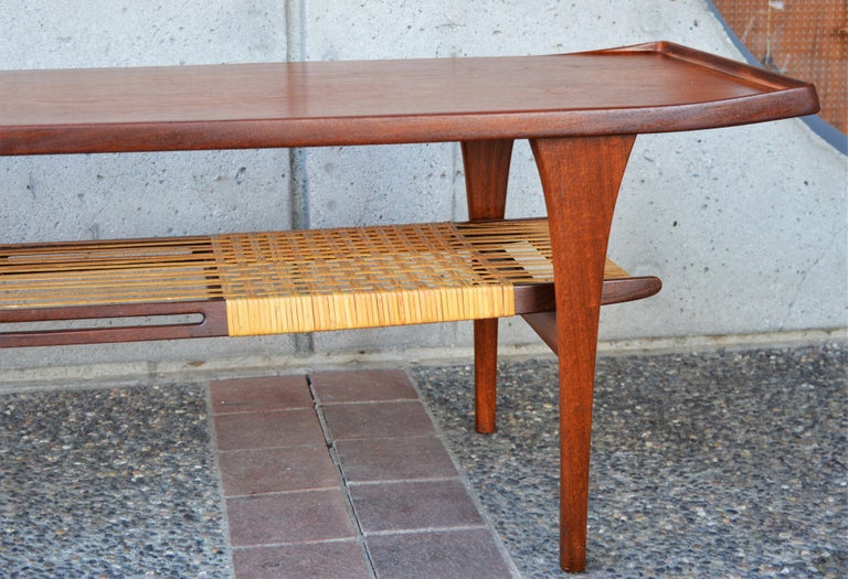 Danish Rare Peter Lovig Nielsen Teak Coffee Table, Flared Ends and Cane Wrapped Shelf For Sale