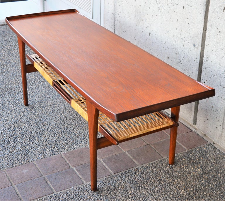 Mid-20th Century Rare Peter Lovig Nielsen Teak Coffee Table, Flared Ends and Cane Wrapped Shelf For Sale