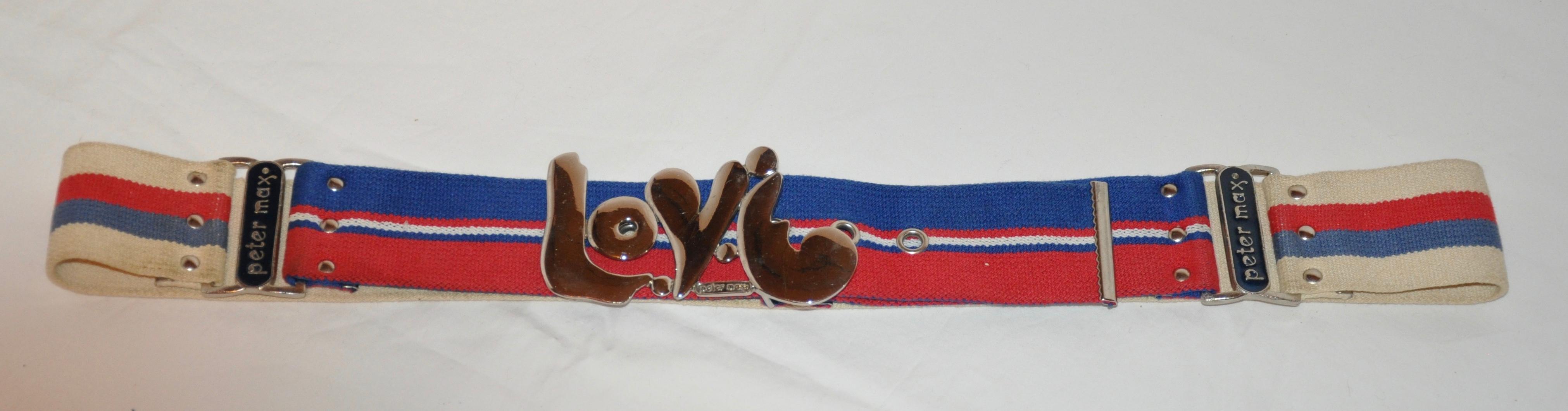     This rare Peter Max designed for Canterburg belt, displays in whimsical lettering 