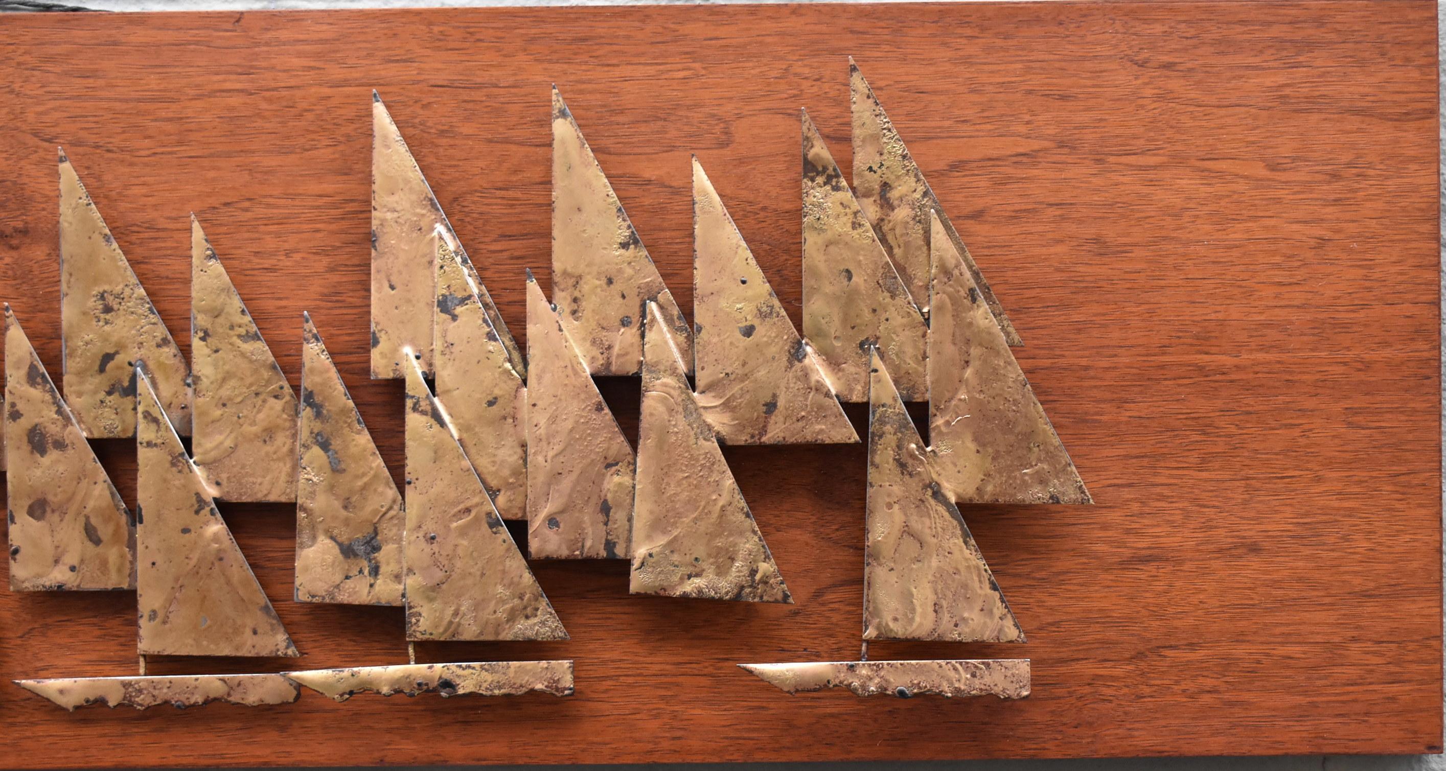 Brass sculptural sailboats on a walnut background by Peter Pepper Products circa 1960's. 12
