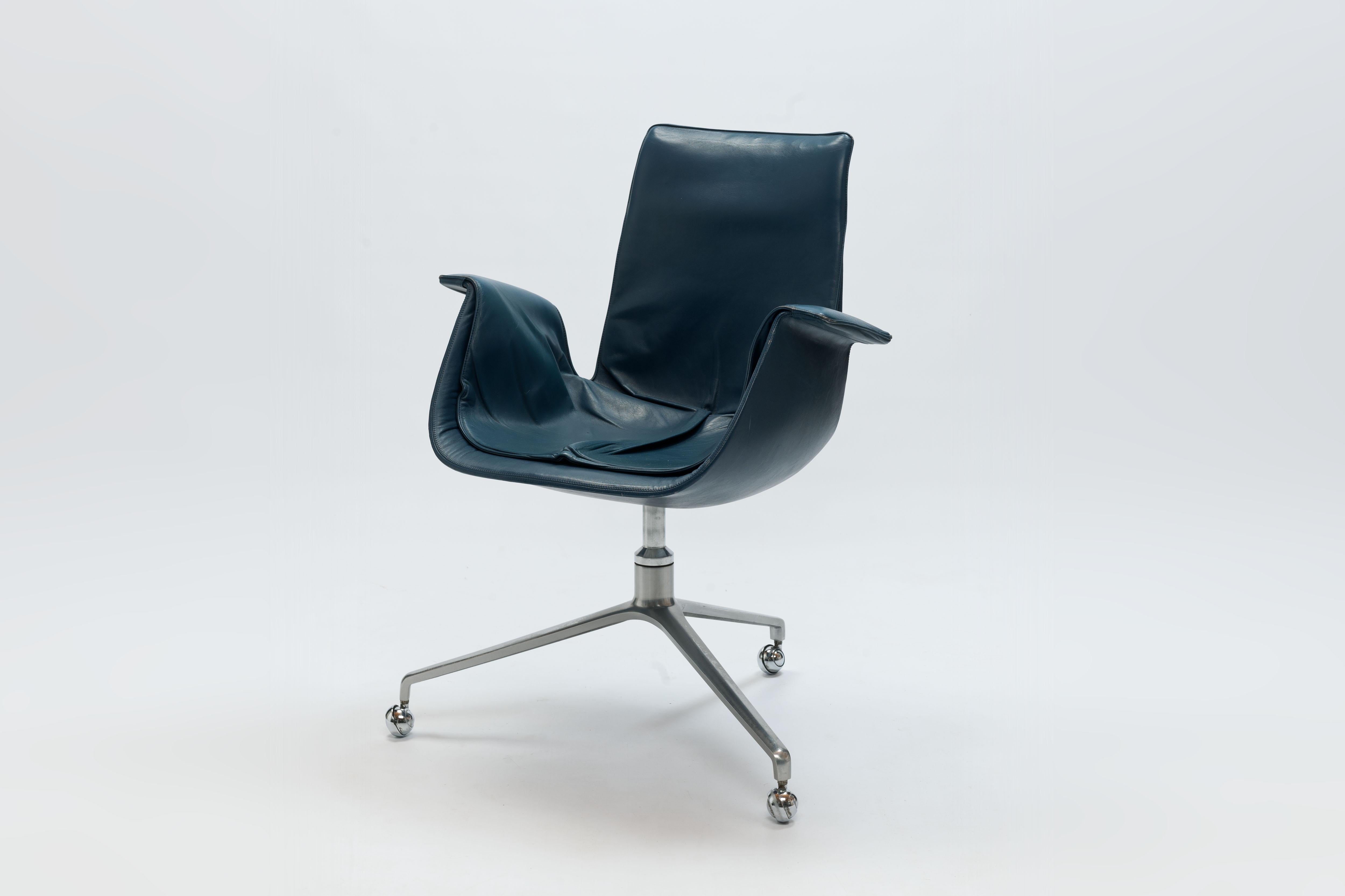 Tulip swivel desk chair model 6726 by Danish designers Preben Fabricius & Jørgen Kastholm on signature three-legged rotating seat on base with metal casters. 
Designed in 1966.  

Second chair comes without swivel / rotating function. 

The chair is