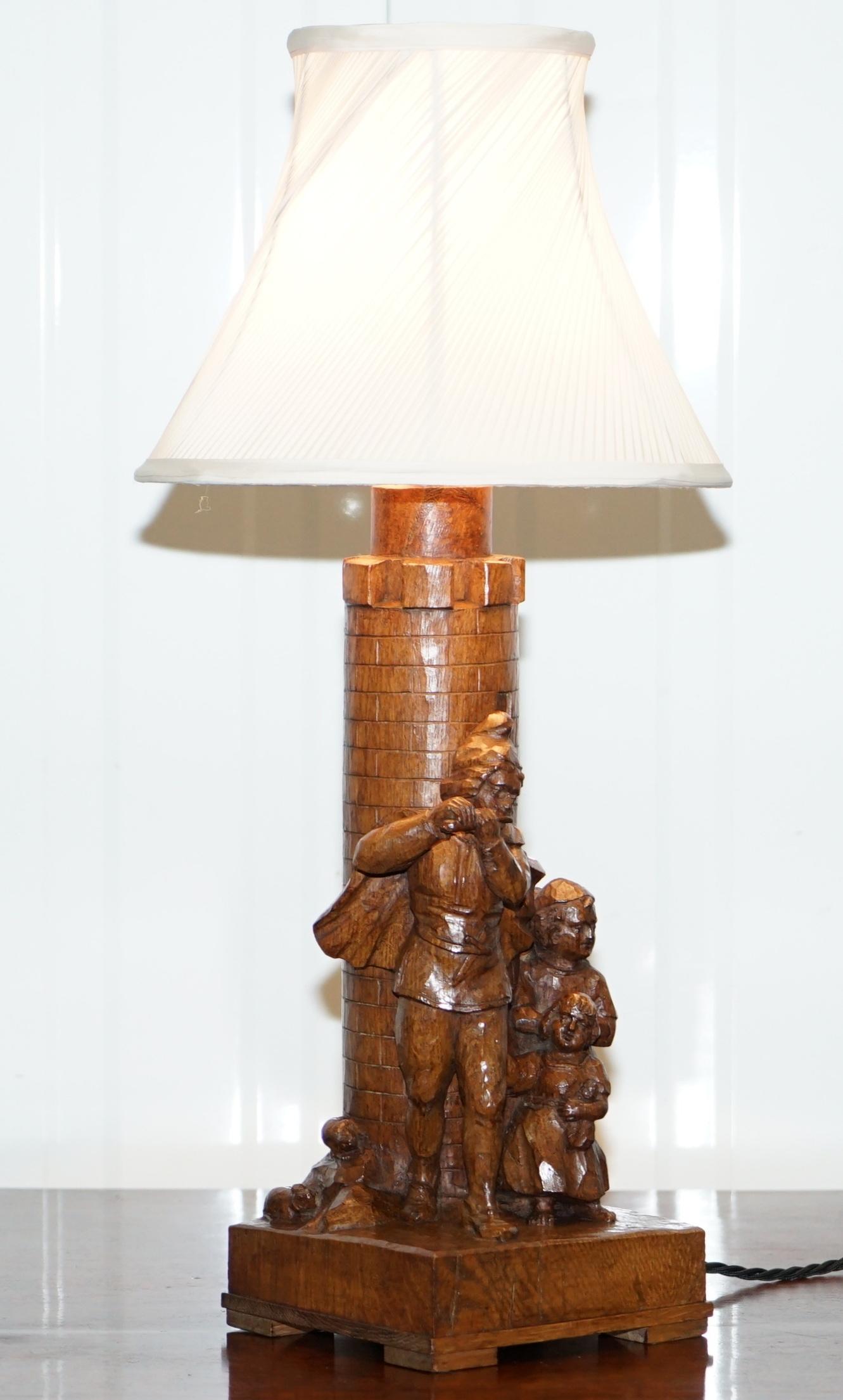 We are delighted to offer for sale this totally original handmade from Black Forest timber Arts & Crafts large table lamp depicting the pied piper of Hamelin and the children following him

A stunning decorative Folk Art hand carved table lamp,
