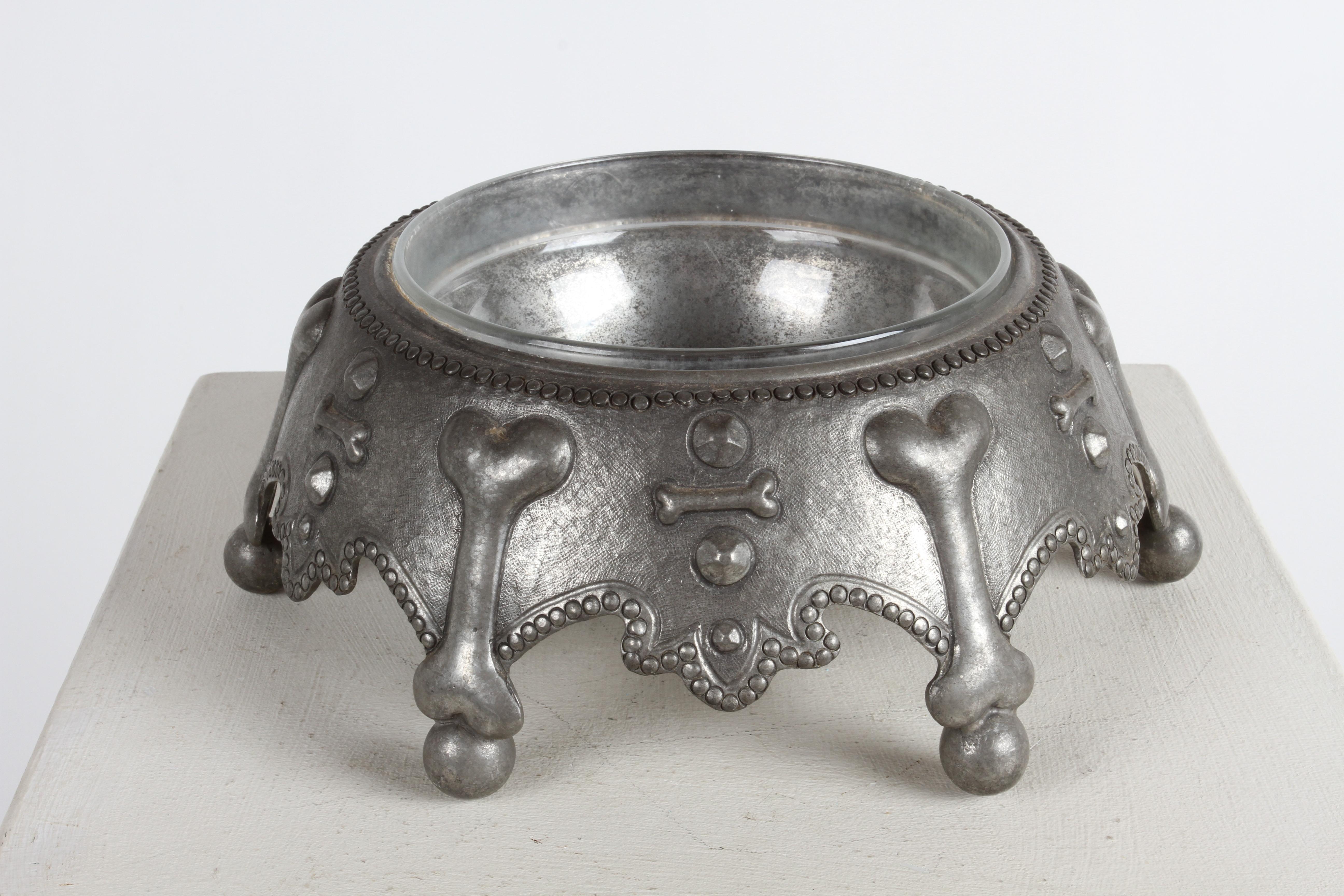 Large Piero Figura for Atena dog bowl, this signed pewter with glass lined upside down crown, having a dog bone motif rests on ball feet. Wonderful warm patina to the pewter, wash it periodically with water and neutral soap and then wipe it with a