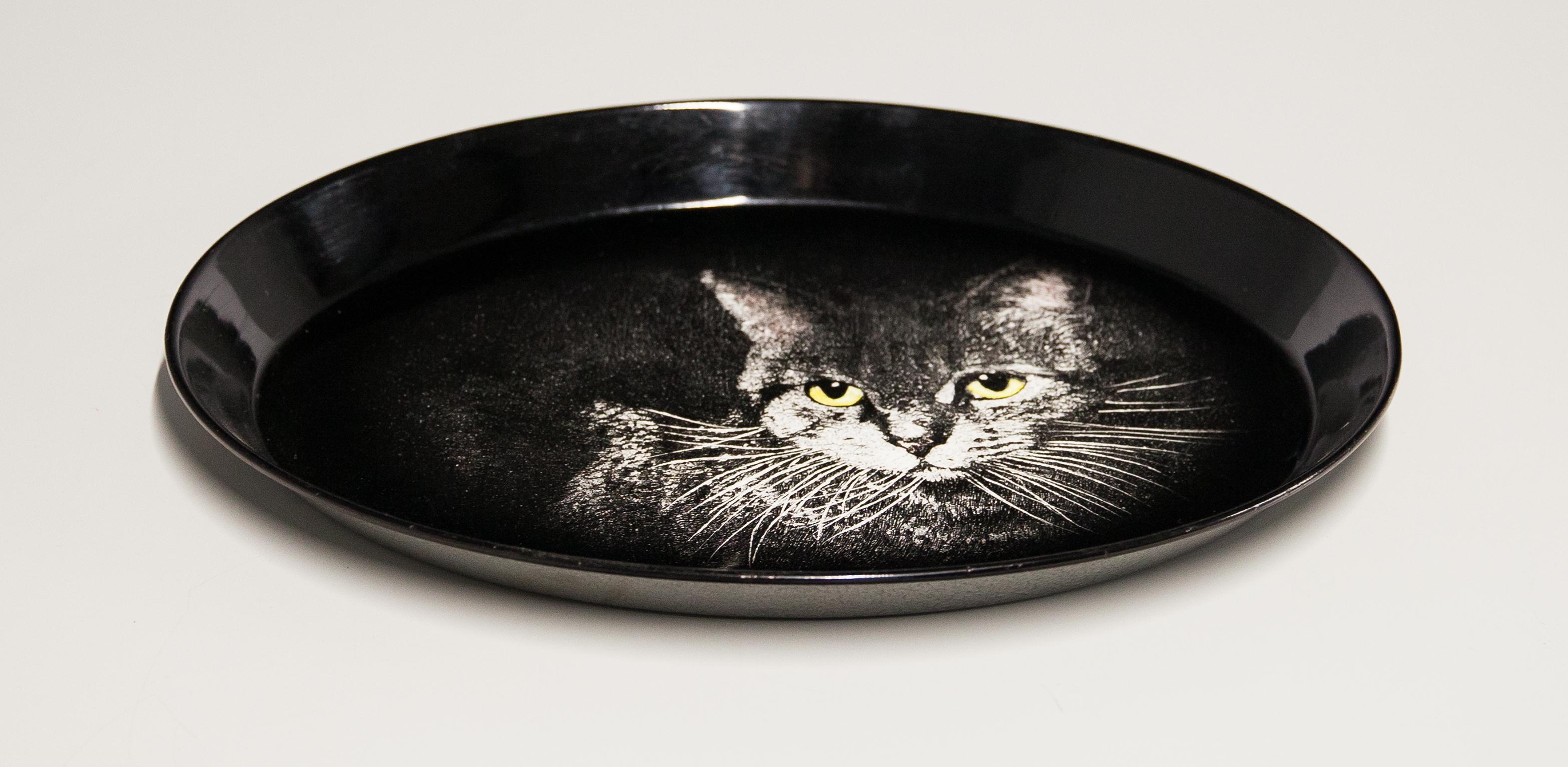 A fabulous light-colored and black version of the tromp l’oeil Tabby cat designed by Piero Fornasetti. Originally designed and produced in the mid-1950s as per the Fornasetti catalogue. Original paper label on the back. Ideal as a kitchen or dining