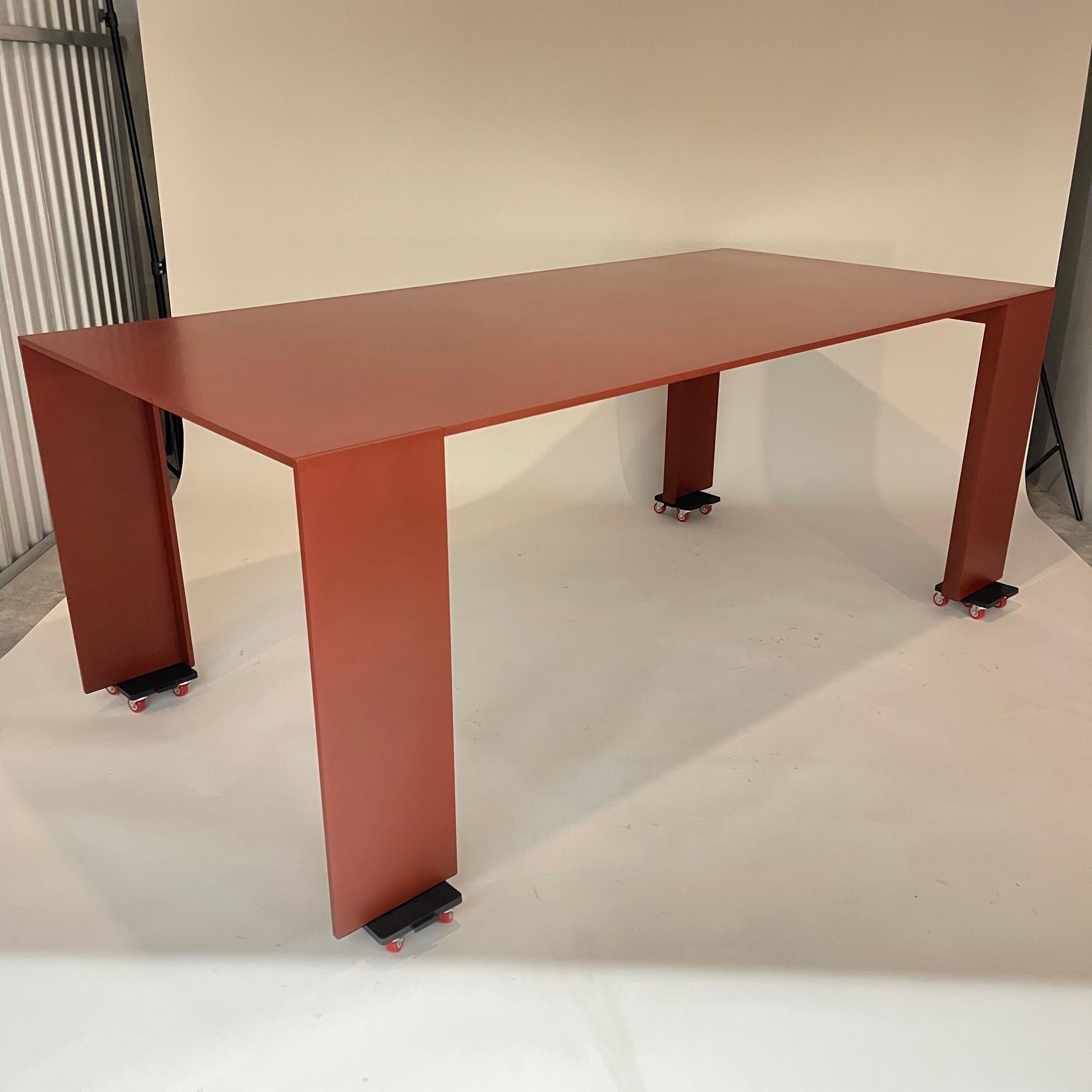 Rare Metallico Dining Table rendered in 12mm Aluminum with a high thickness catalyzed antique red paint and hand waxed finish, signed.  designed by Piero Lissoni for Porro SPA, Italy 2011.