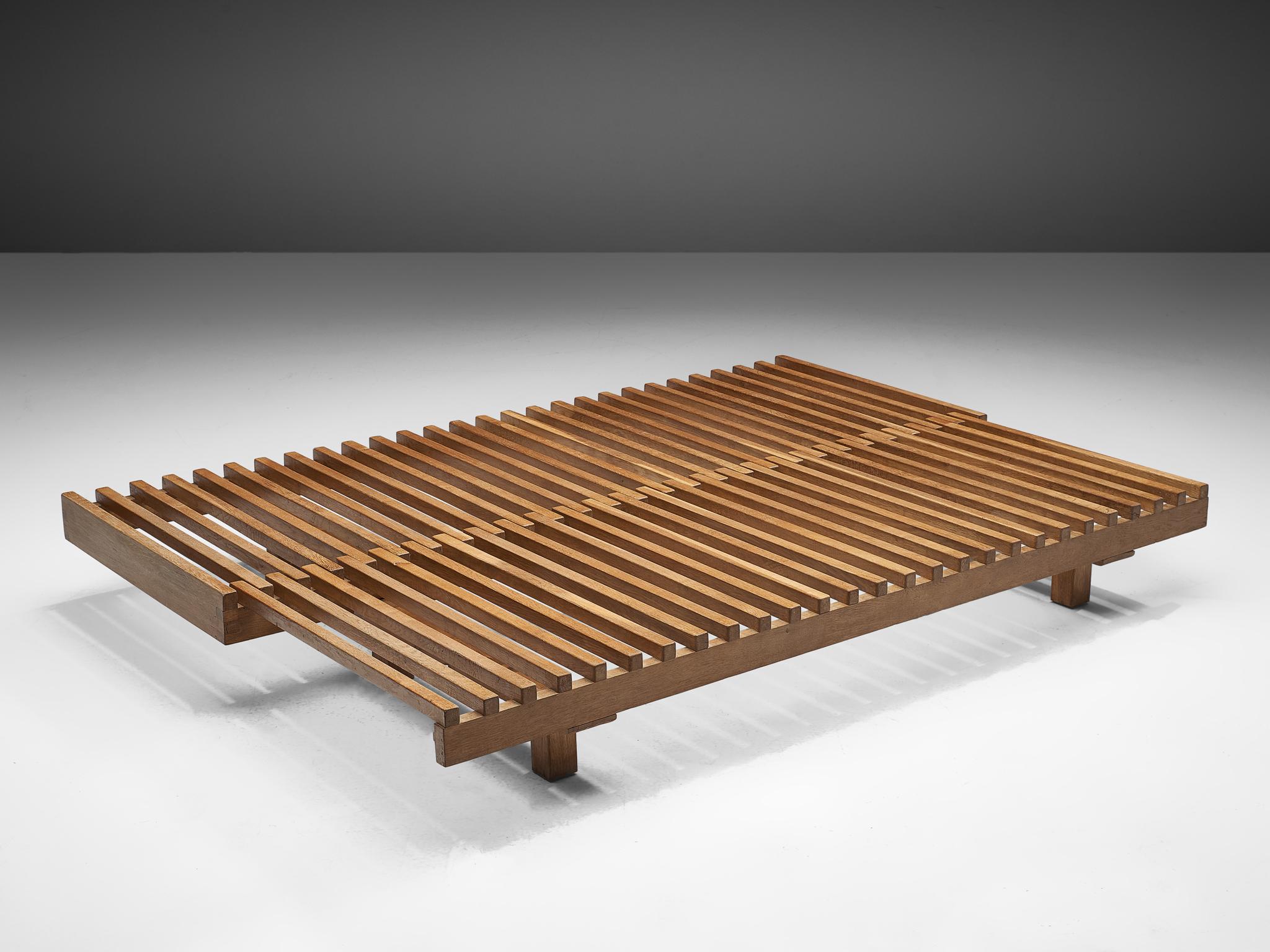 Pierre Chapo, L07 extendable day bed, oak, France, 1963.

This exquisite slidable wood structure, can create space for one or two people to lay on it. This piece impeccable in its technique, as it can be modified to the desired function without any