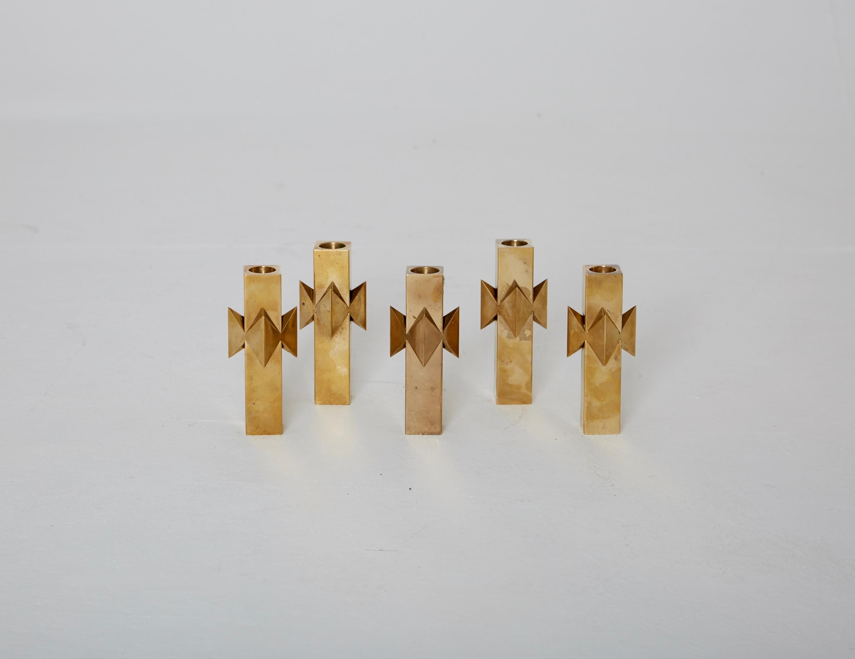 Stunning, modernist brass candlesticks designed by Pierre Forssell for Skultuna, Sweden. Stamped with makers mark. Five available. Price is per piece.

Measures: Weight 1020 g.
14 cm H x 8 cm W x 4cm D.
