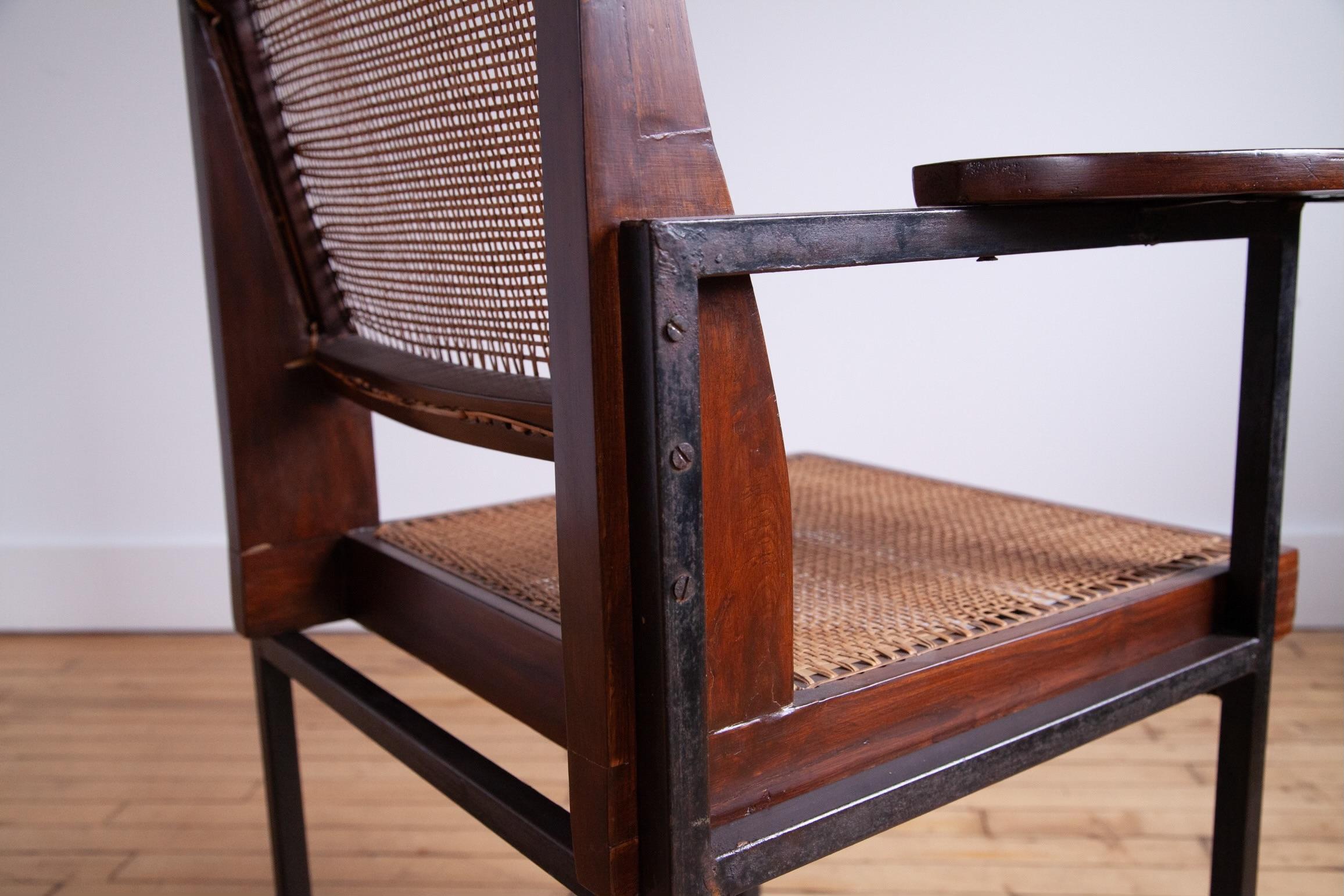 This is a highly unusual and rare Pierre Jeanneret Classroom Chair, likely from Punjab University circa 1960. 

More often we see the classroom chairs in with solid teak legs. Here the legs are metal. 

This is a genuine collector piece. 

Please