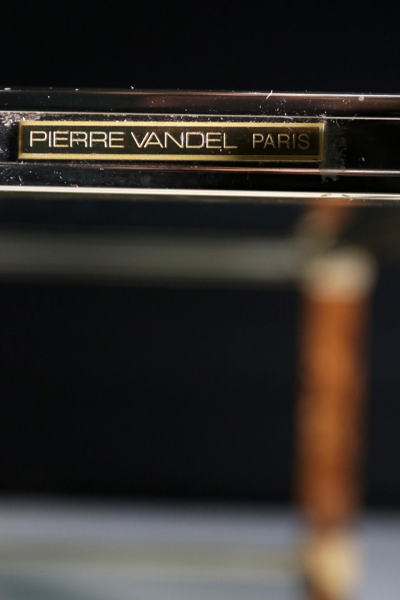 Pierre Vandel Paris two-tier coffee table Mid-Century Modern made in France in the 1970s.
Very elegant.
  
Measurements: W 128 x D 79 x H 40 cm.