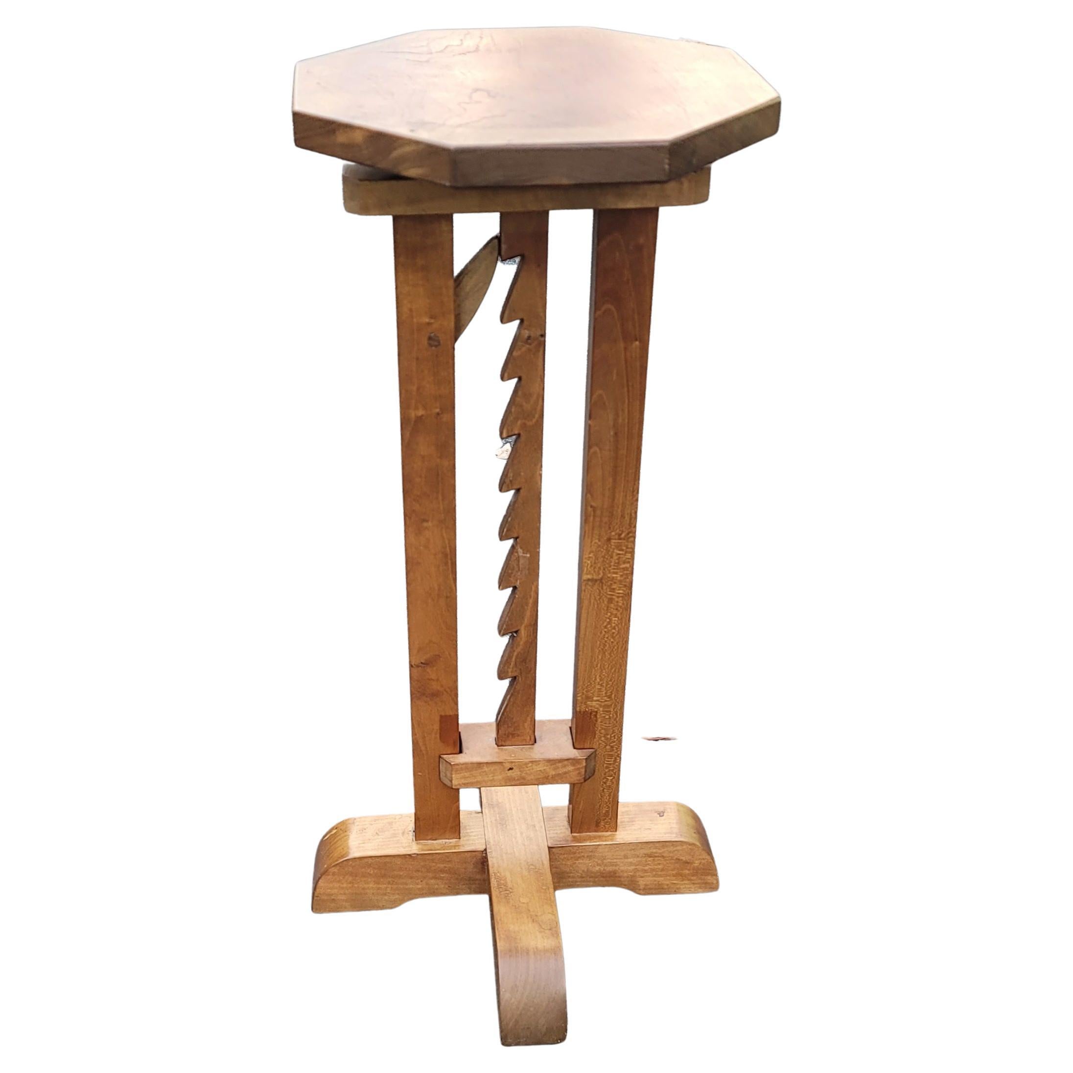  A rare pilgrim century X-base adjustable height candle stand fromthe late 19th century, New England. The octogonal top on a rectangular trammel cut post adjusts on wood ratchet.  Base is 11