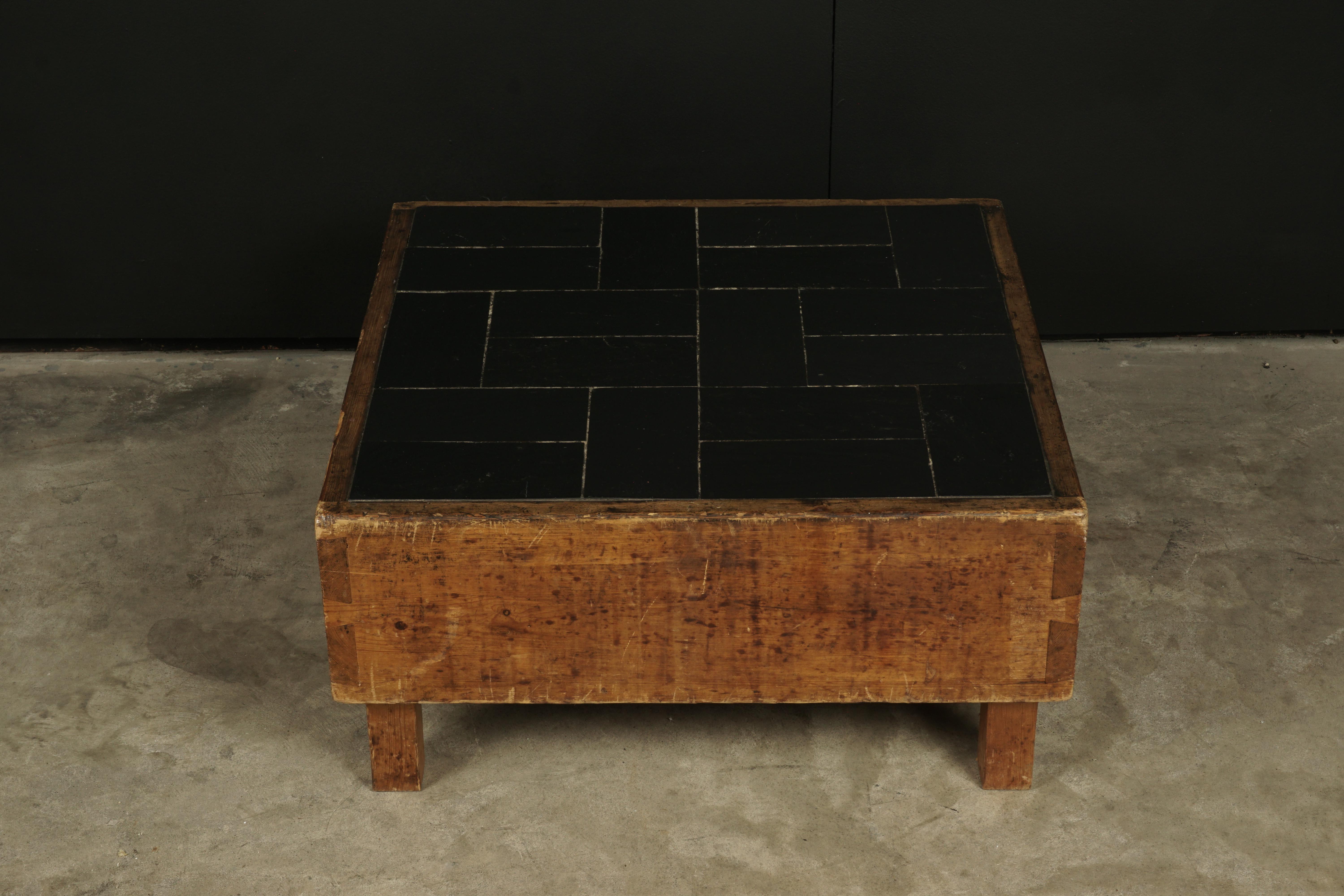 Rare pine coffee table from France, 1960s. Solid joined pine construction with slate tiles on the top. Very unusual model.