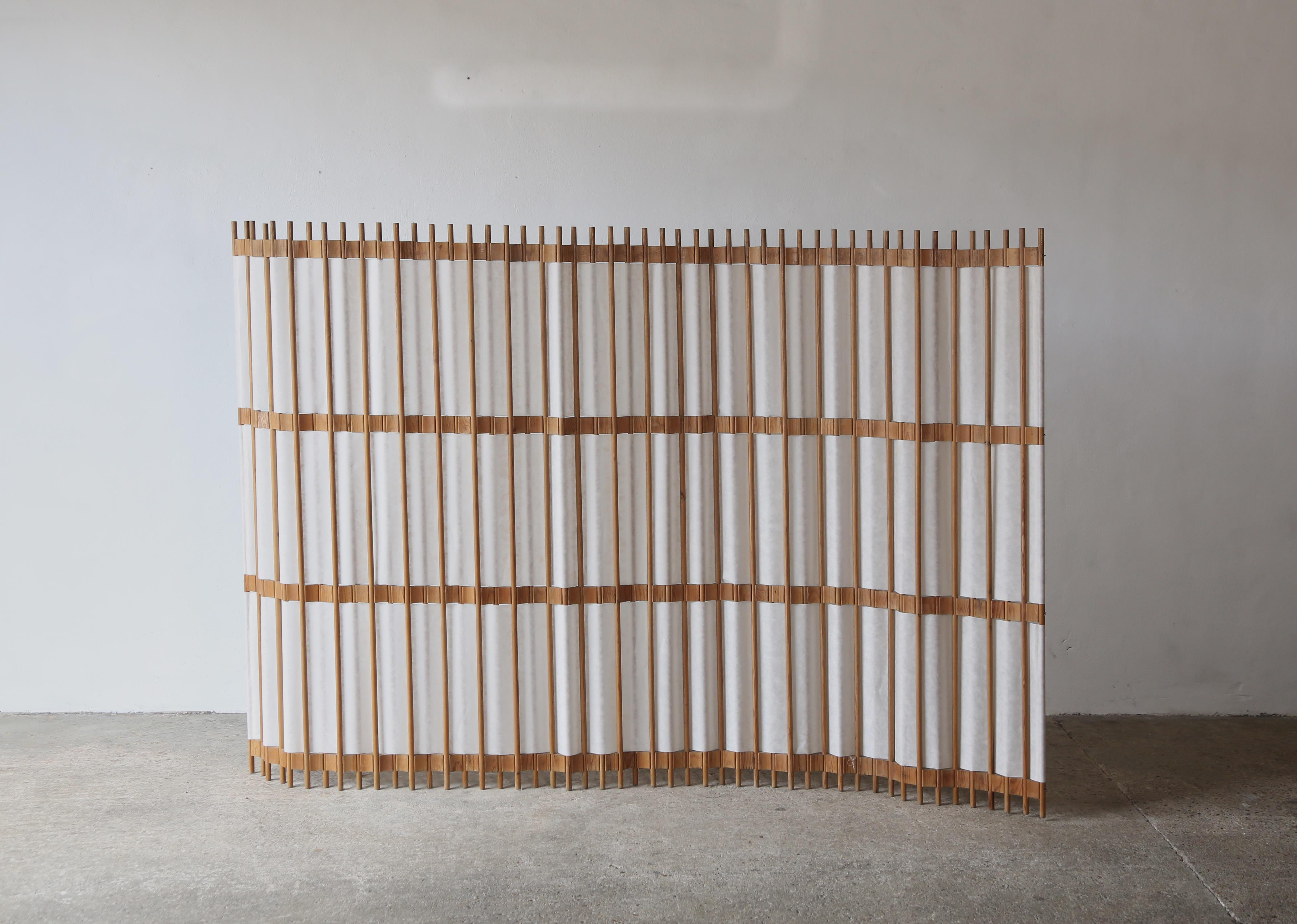A rare pine screen / room divider, Sweden, 1960s/70s. In good condition with minor signs of age and wear relative to age and use. The screen curves and bends and can be put in various positions. Pine and Japanese Shoji paper.  The paper is quite