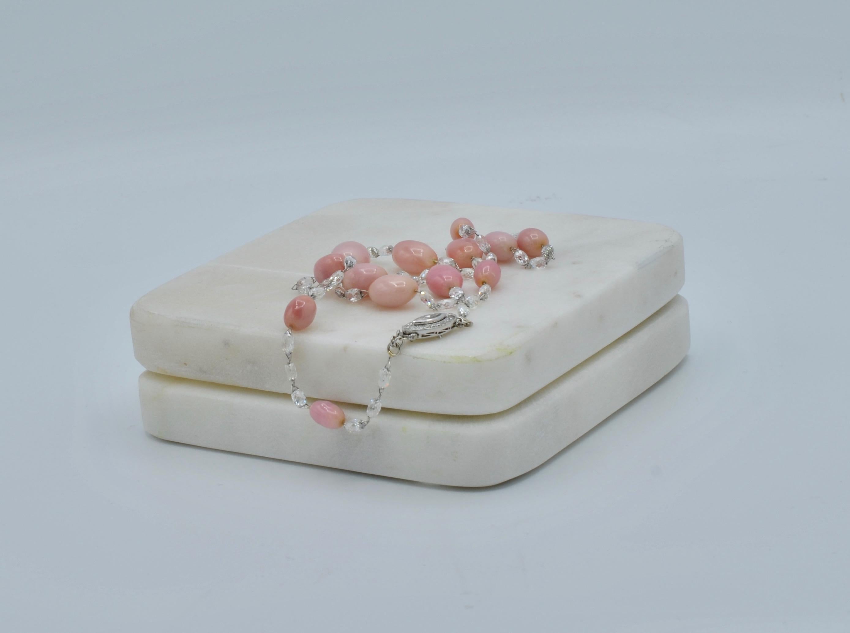 This stunning Diamond and Natural Conch Pearl necklace is very rare and unique. Pretty and pastel-hued, a conch pearl is a calcareous concretion produced by the Queen conch (pronounced “conk”) mollusk, which is a large, edible sea snail. Most often