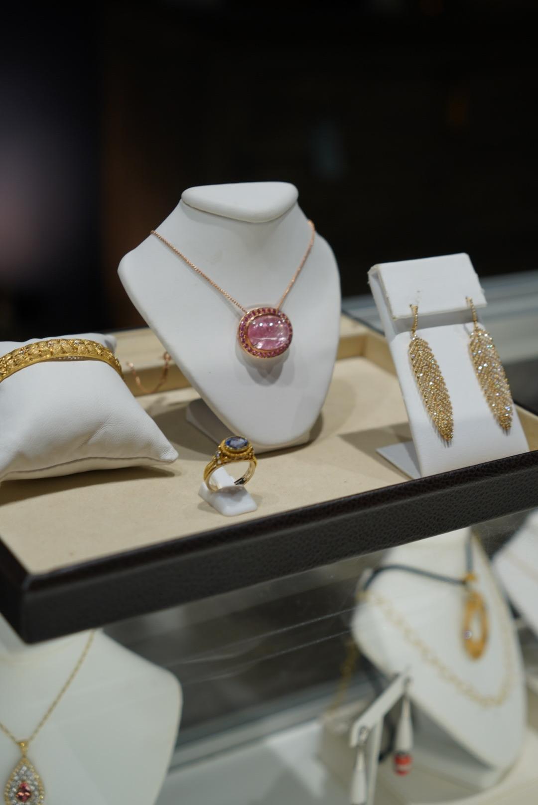 Rare Pink Tanzanite Cabochon Necklace in 18 kt Rose Gold surrounded with Mahenge Spinels.   28 cts. center stone.  It's the largest pink tourmaline we've ever worked with and this stone is entirely untreated and unenhanced.

Created by noted jewelry