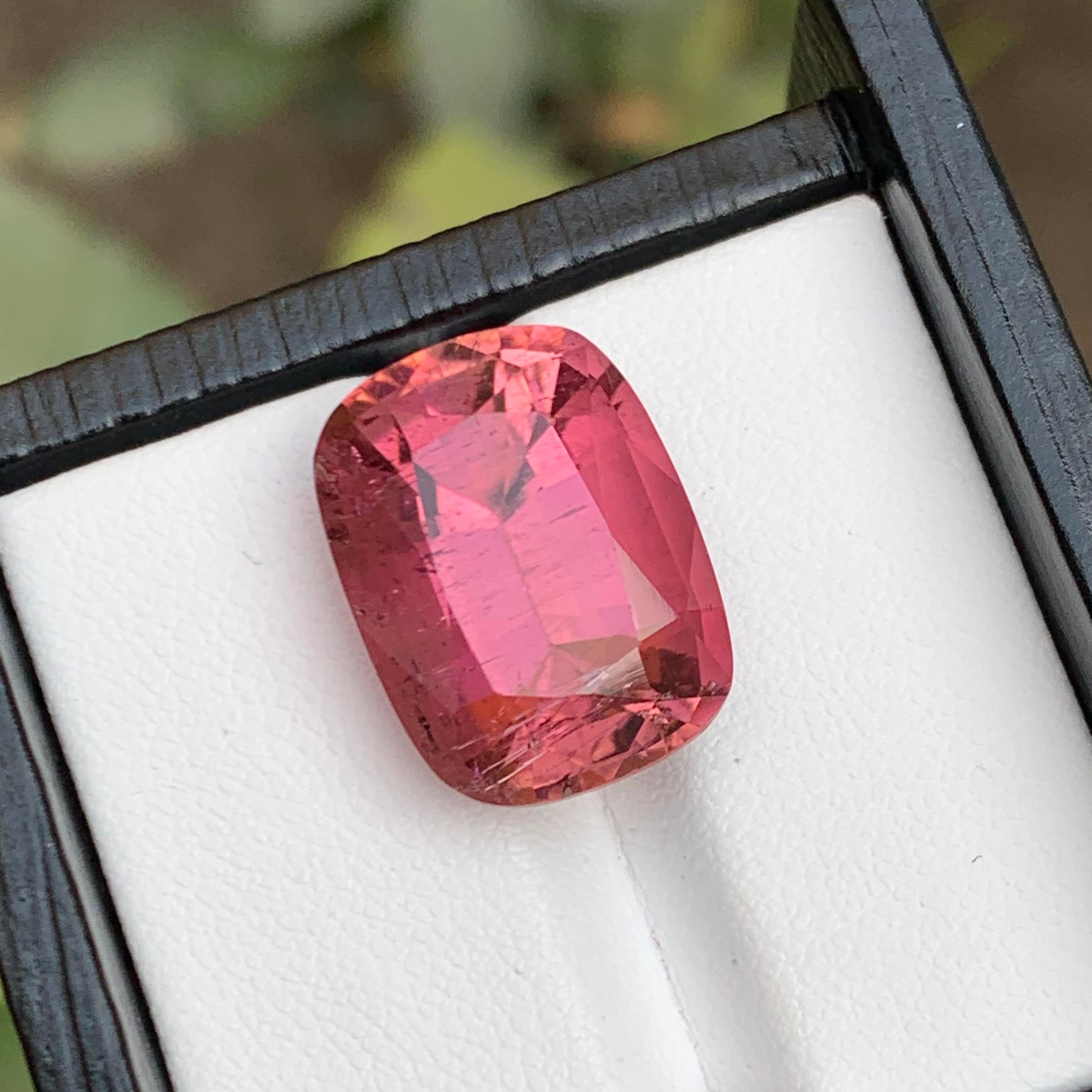 GEMSTONE TYPE: Tourmaline
PIECE(S): 1
WEIGHT: 14.50 Carat
SHAPE: Cushion 
SIZE (MM):  17.14 x 12.86 x 9.56
COLOR: Pink
CLARITY: Slightly Included
TREATMENT: Heated
ORIGIN: Afghanistan
CERTIFICATE: On demand 

This stunning 14.50 carat cushion cut