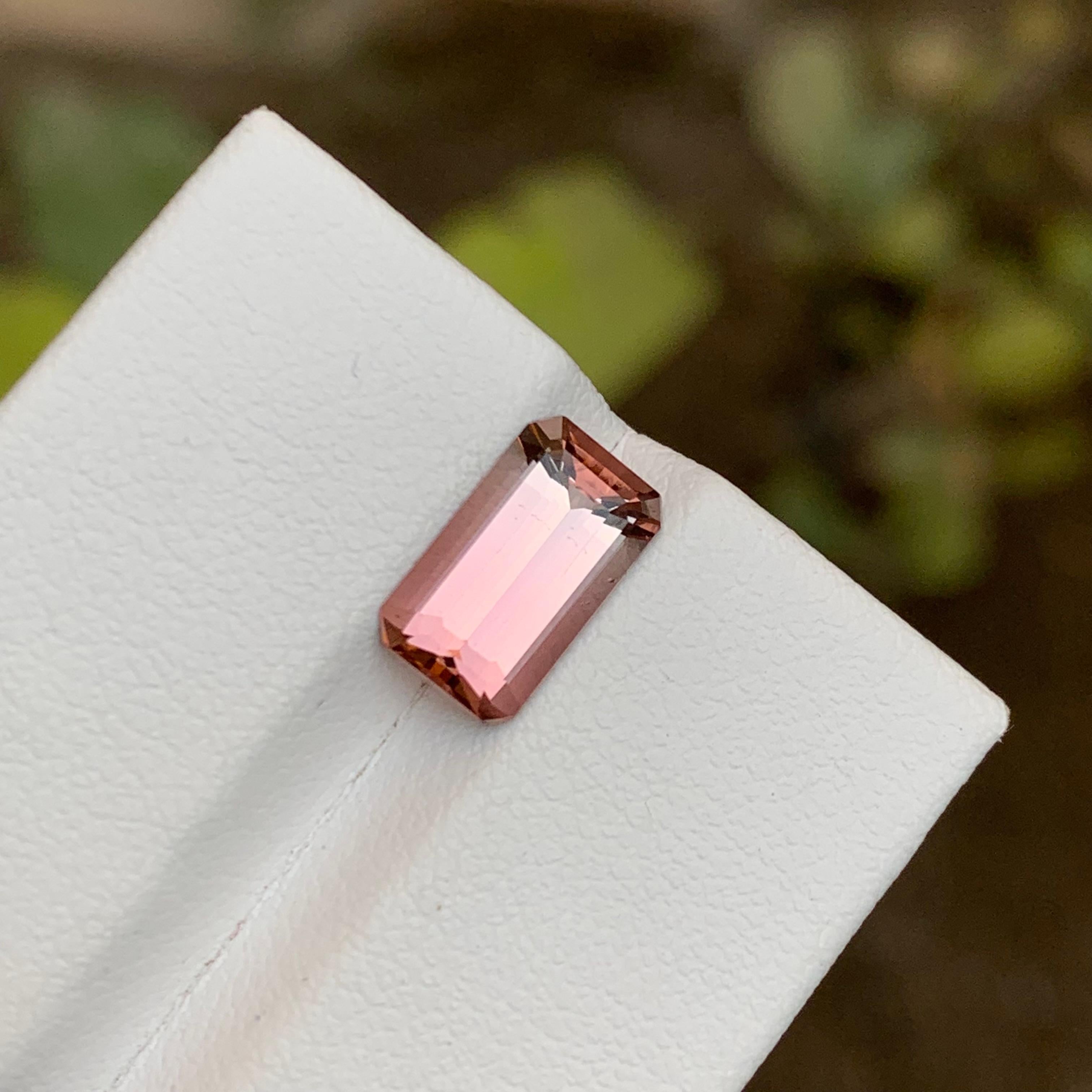 GEMSTONE TYPE: Tourmaline
PIECE(S): 1
WEIGHT: 2.45 Carats
SHAPE: Emerald
SIZE (MM):  10.74 x 6.23 x 4.47
COLOR: Pink
CLARITY: Approx 97% Eye Clean
TREATMENT: Heated
ORIGIN: Afghanistan
CERTIFICATE: On demand

Captivate hearts with this mesmerizing