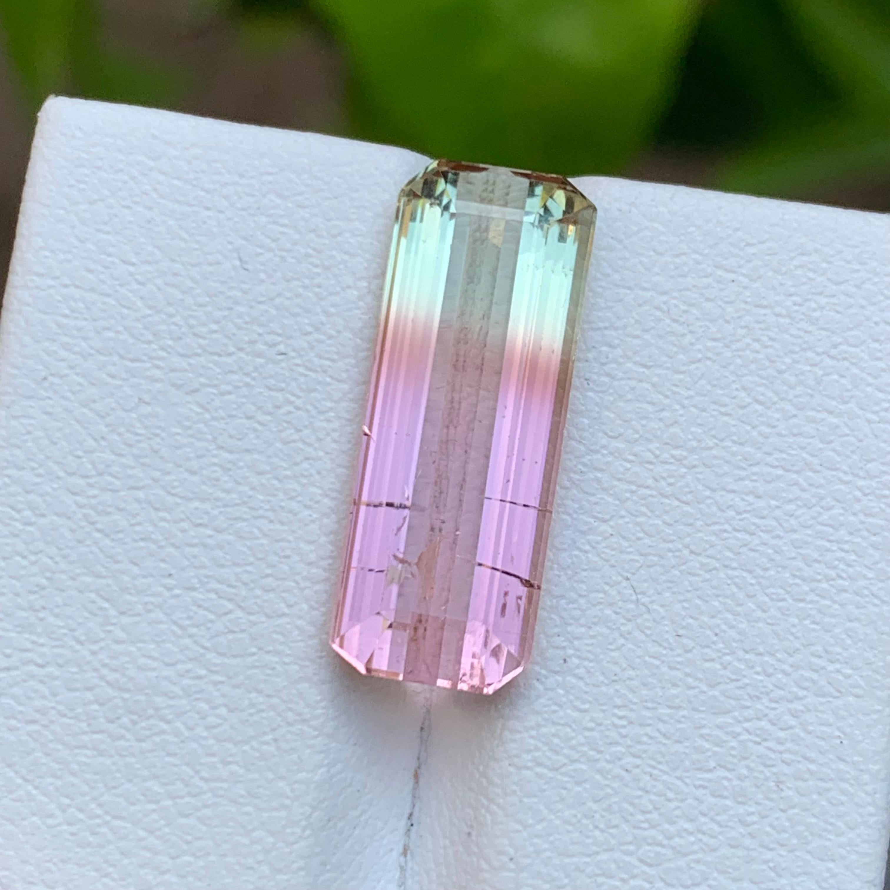 GEMSTONE TYPE: Tourmaline
PIECE(S): 1
WEIGHT: 8.35 Carats
SHAPE: Emerald
SIZE (MM): 19.77 x 7.56 x 5.60
COLOR: Bicolor Pink & Pale Green
CLARITY: Slightly Included with minor crack
TREATMENT: Heated
ORIGIN: Afghanistan
CERTIFICATE: On demand

A very