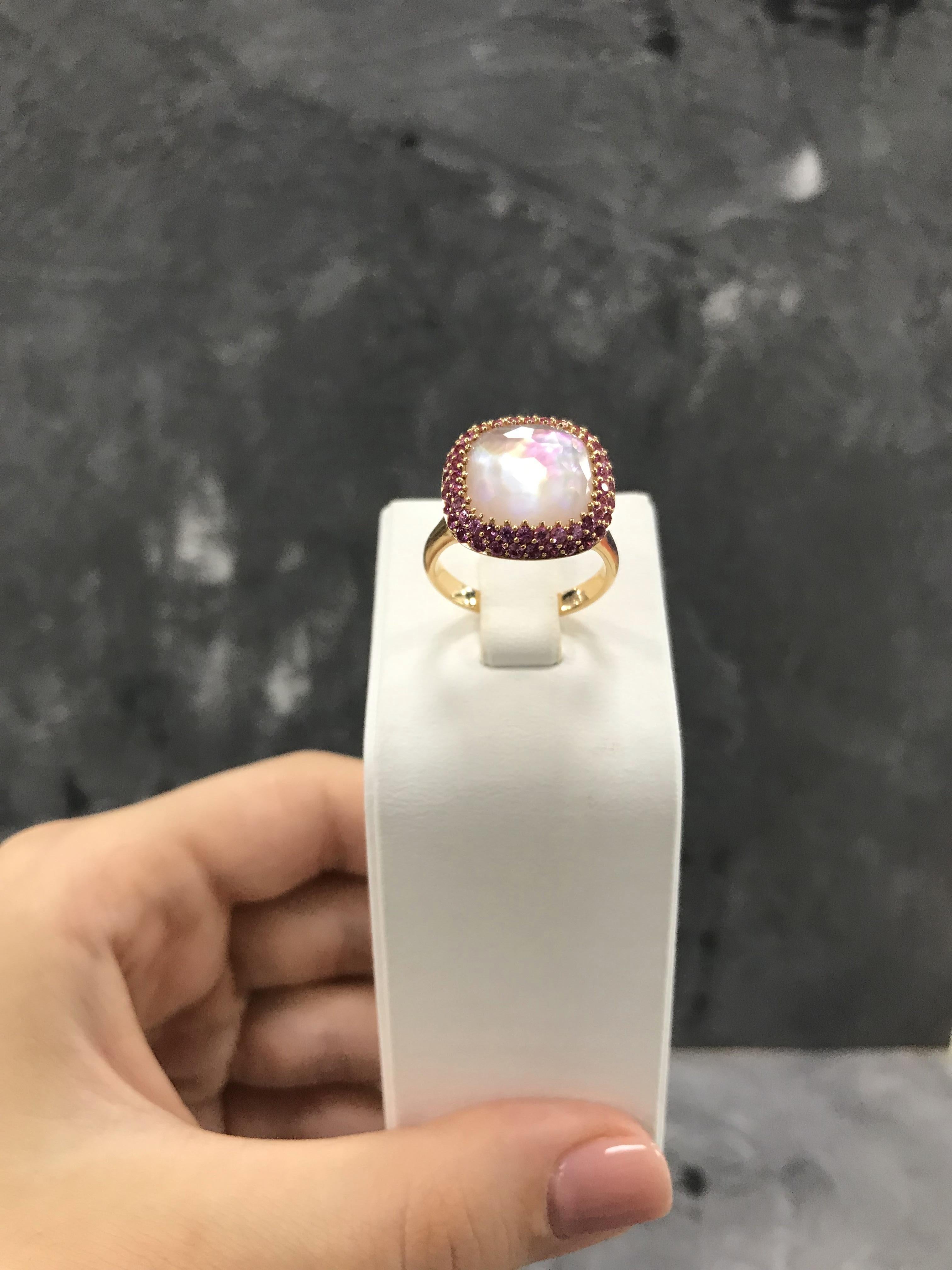 Rose Gold 18 K
Pink sapphire58-Round-1,14 3/2A 
Mother of pearl 1-1,1 ct 
Rock crystal 1-Square-4,7 1/1A  
Weight 8,31 gram
Size 17,5

With a heritage of ancient fine Swiss jewelry traditions, NATKINA is a Geneva based jewellery brand, which creates