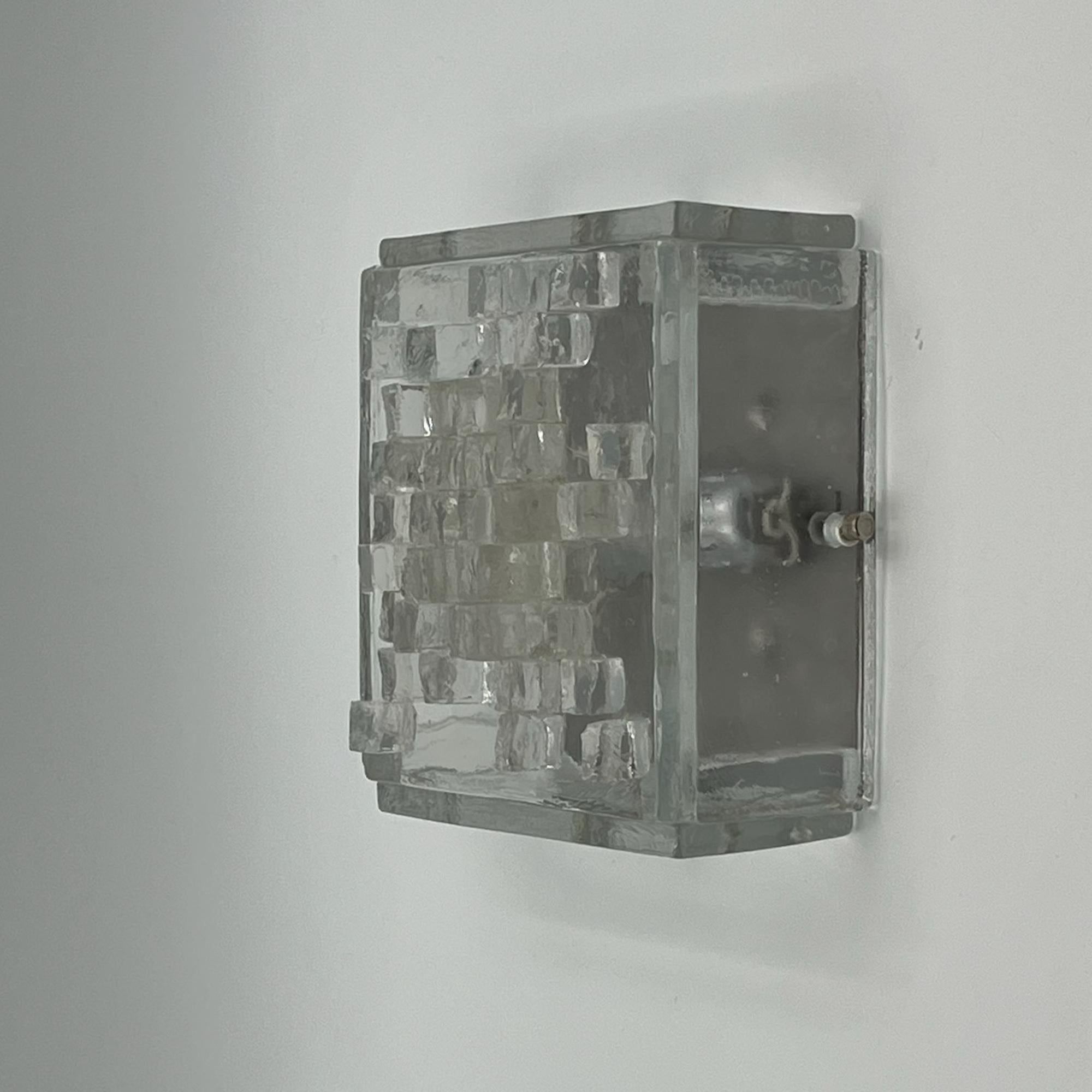 Immerse yourself in the captivating allure of vintage design with the rare and exquisite Poliarte 70s brutalist lamp. Handmade by the iconic artisans of Verona, Italy, this stunning wall or ceiling light is a true testament to the craftsmanship and