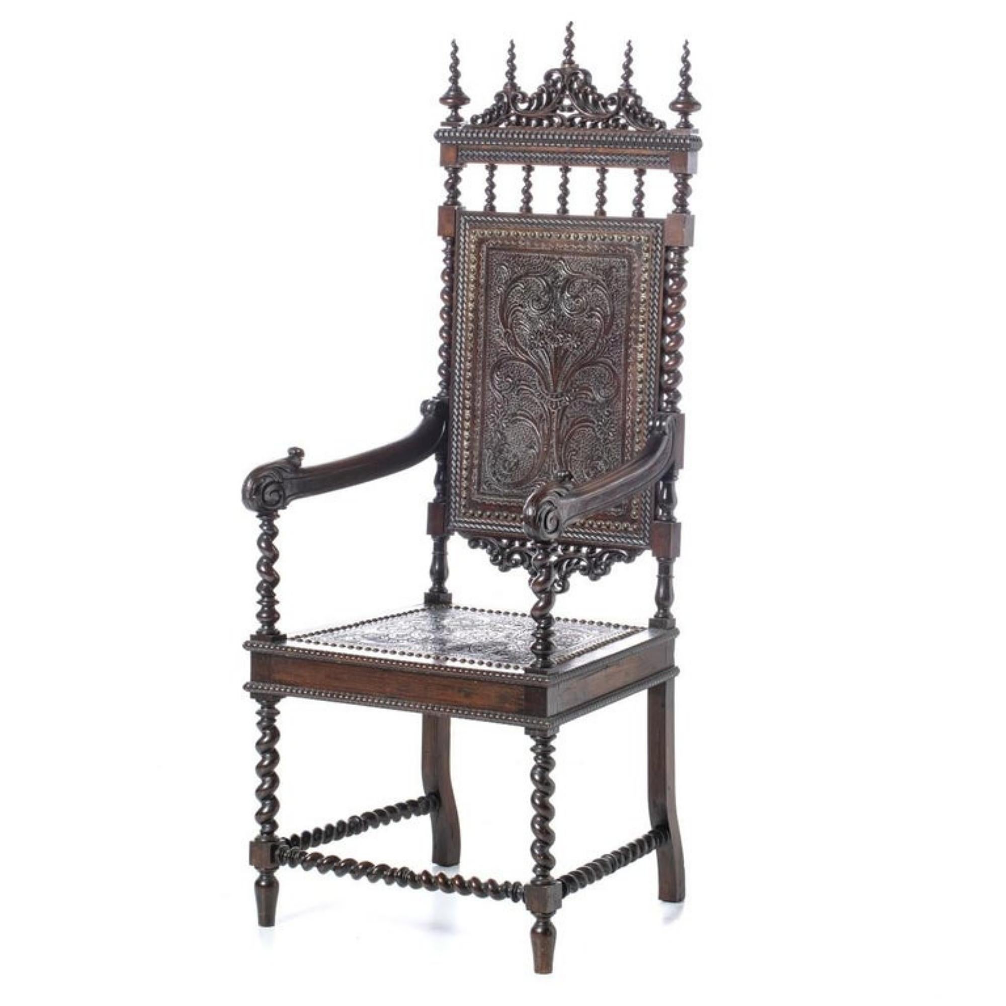 Rare Portuguese armchair
19th century
in kingwood, back and seats with leather and studs, decorated with plant motifs. 
Signs of use. 
Dim.: 140 x 55.5 x 48 cm.