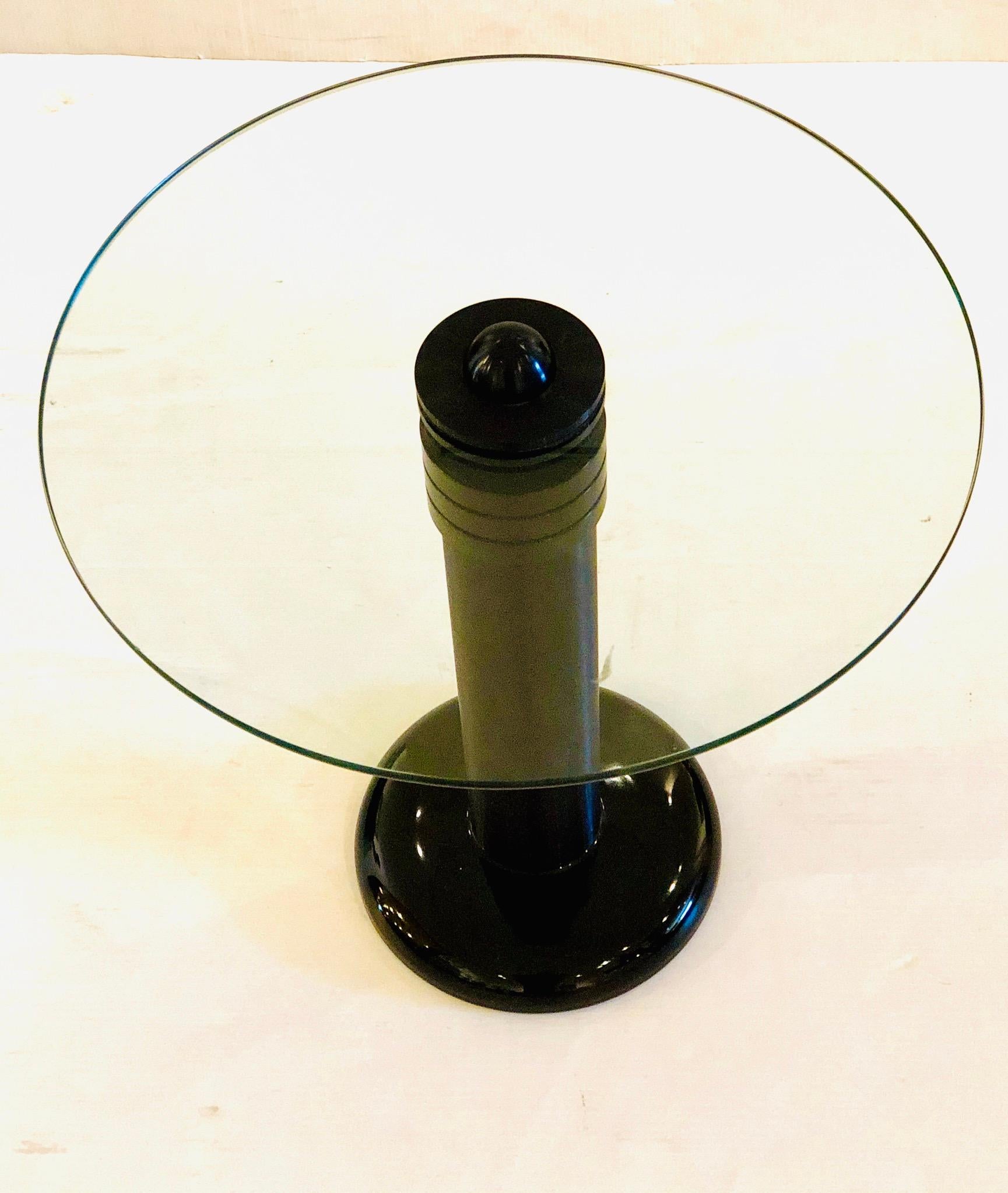 And incredible and unique end cocktail table designed by Kaiser-Newman circa 1980s aluminum pole with porcelain base, and a glass round top perfect to put side by a chair or in between 2 club chairs.