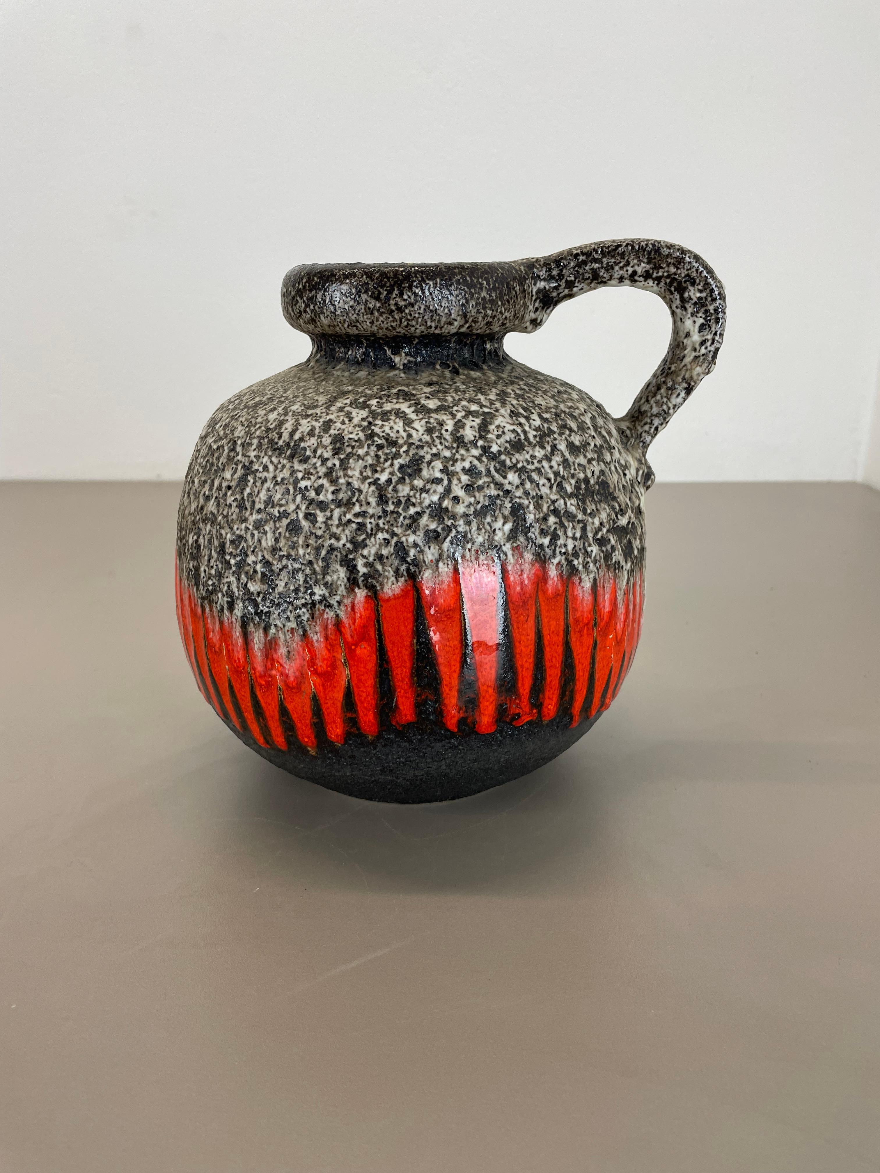 Article:

Fat lava art vase ZIG ZAG



Producer:

Scheurich, Germany



Decade:

1970s




This original vintage vase was produced in the 1970s in Germany. It is made of ceramic pottery in fat lava optic with abstract illustration in very strong