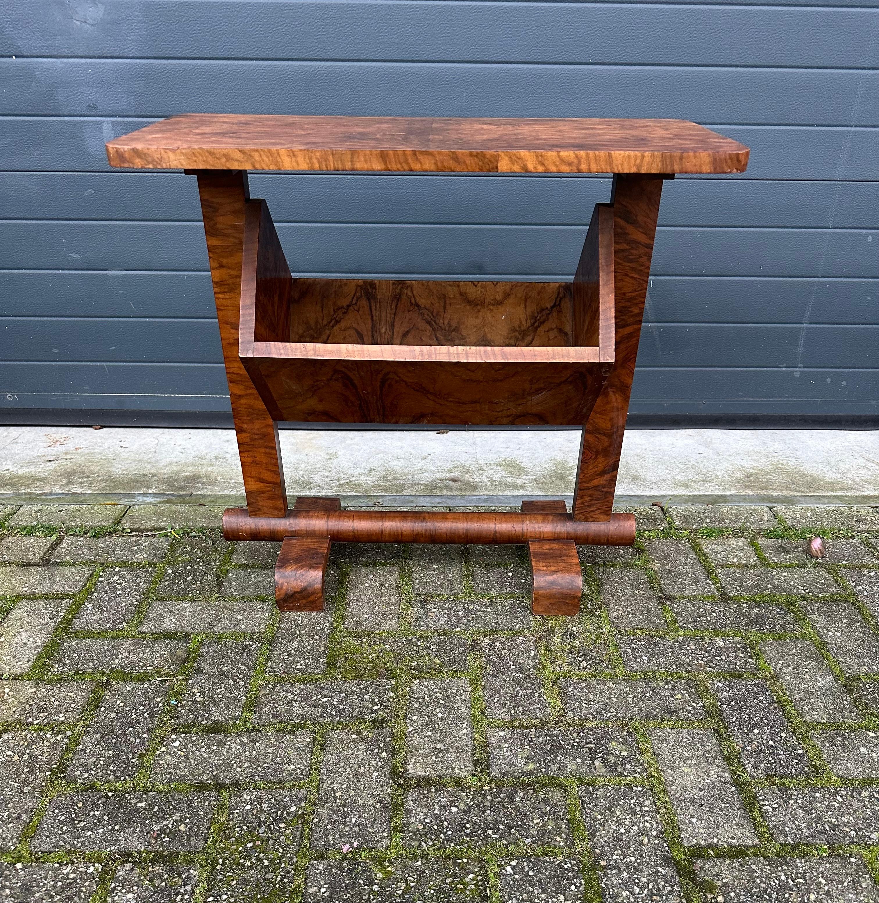 Rare and practical Art Deco books table, made of very beautiful burl walnut veneer.

This stylish and possibly unique Art Deco table and bookcase into one could be the perfect finish to a small area for reading, rest and relaxation. However, this