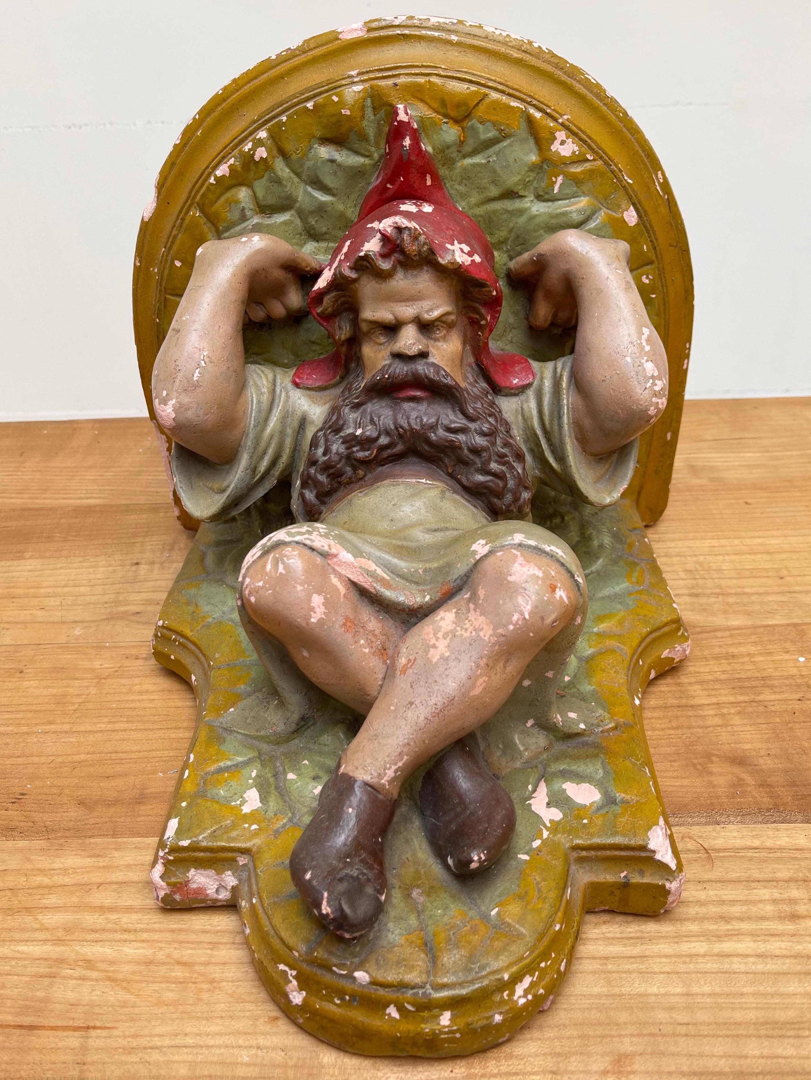 Beautiful and very decorative gnome bracket in deep relief.

If you are a collector of rare and interesting antiques then this bracket could be the perfect addition to your home or garden. This handcrafted and colorful, hand-painted wall bracket