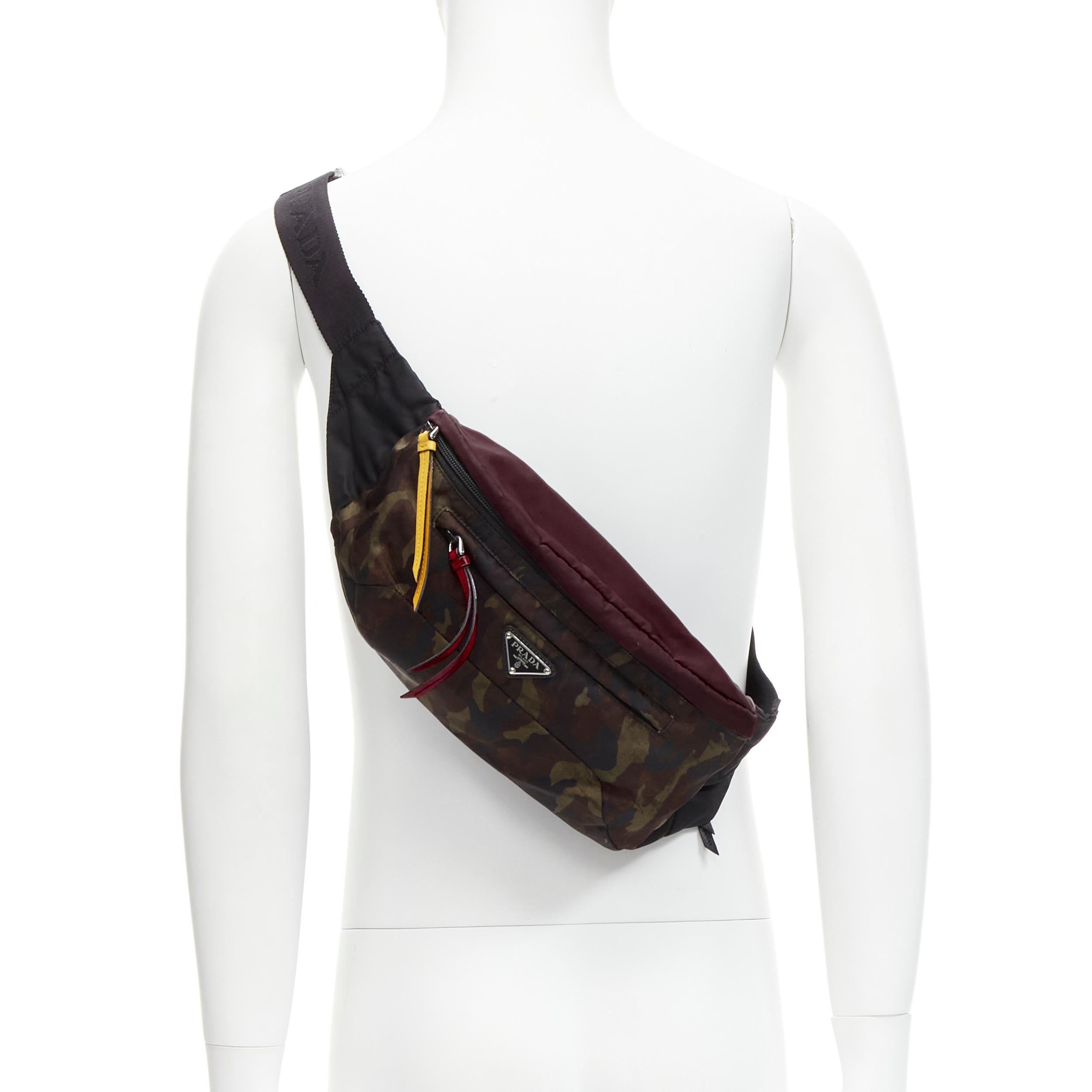 rare PRADA green brown camo nylon colorful zip pull waist bum bag
Reference: TGAS/C01621
Brand: Prada
Designer: Miuccia Prada
Material: Nylon
Color: Green
Pattern: Camouflage
Closure: Zip
Lining: Fabric
Made in: Italy

CONDITION:
Condition: Good,